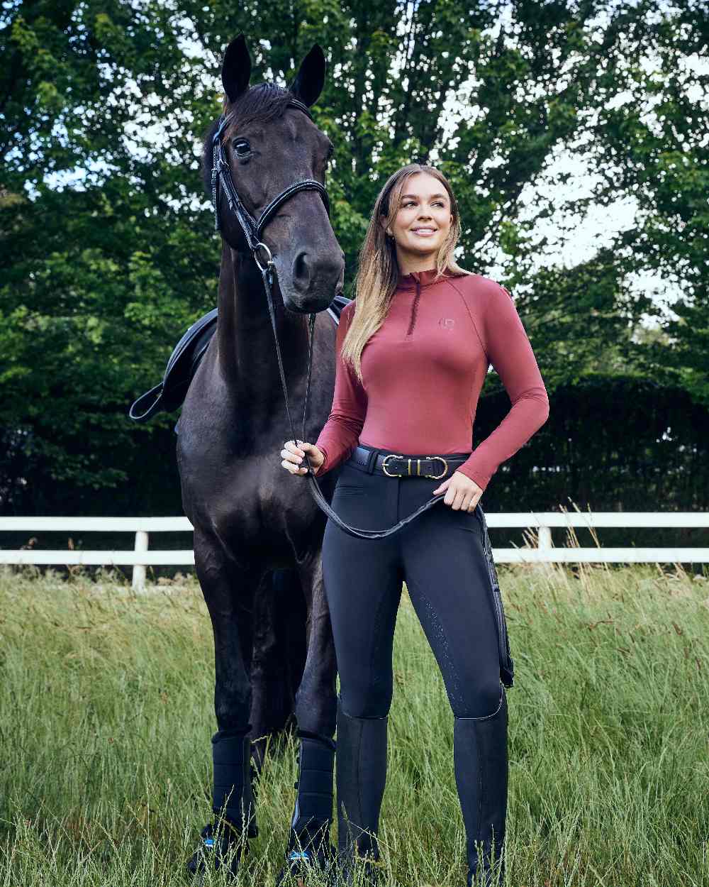 Cabernet coloured Dublin Womens Brushed Long Sleeve Riding Top on horse background