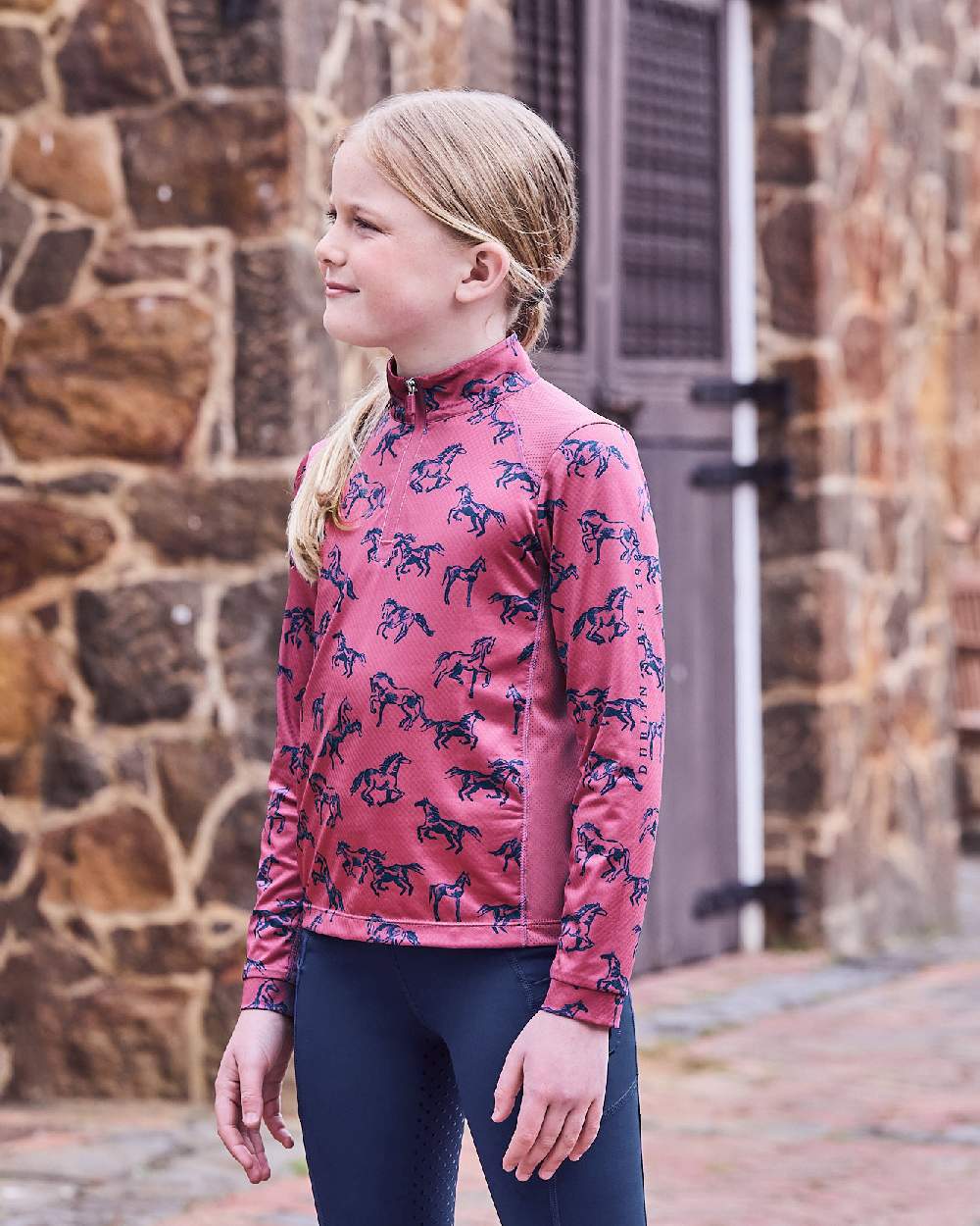 Red Violet Frolicking Horses coloured Dublin Childrens Autumn Sally Long Sleeve Riding Top on street background