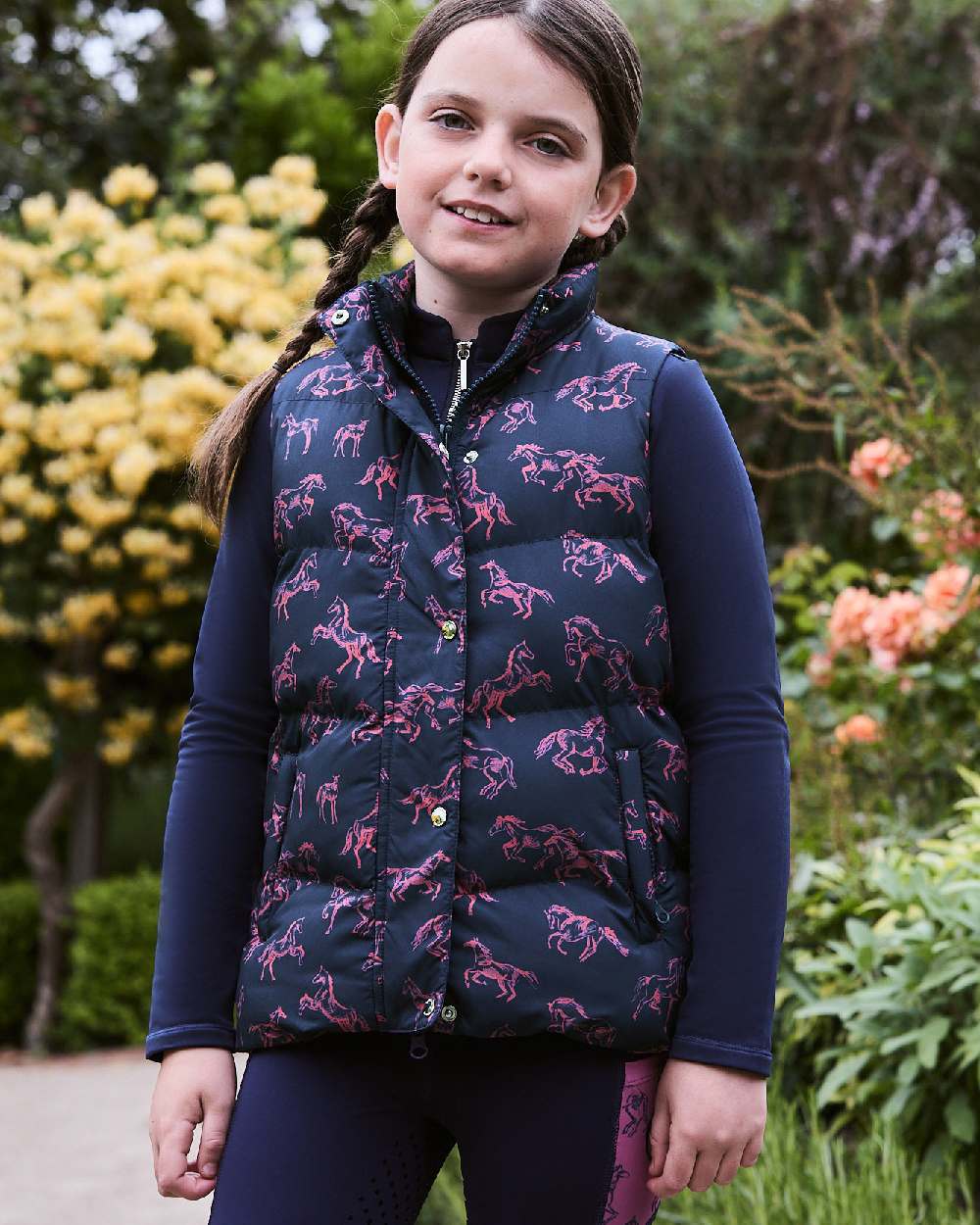 Navy Frolicking Horses coloured Dublin Childrens Patrice Everyday Puffer Vest on Plants background