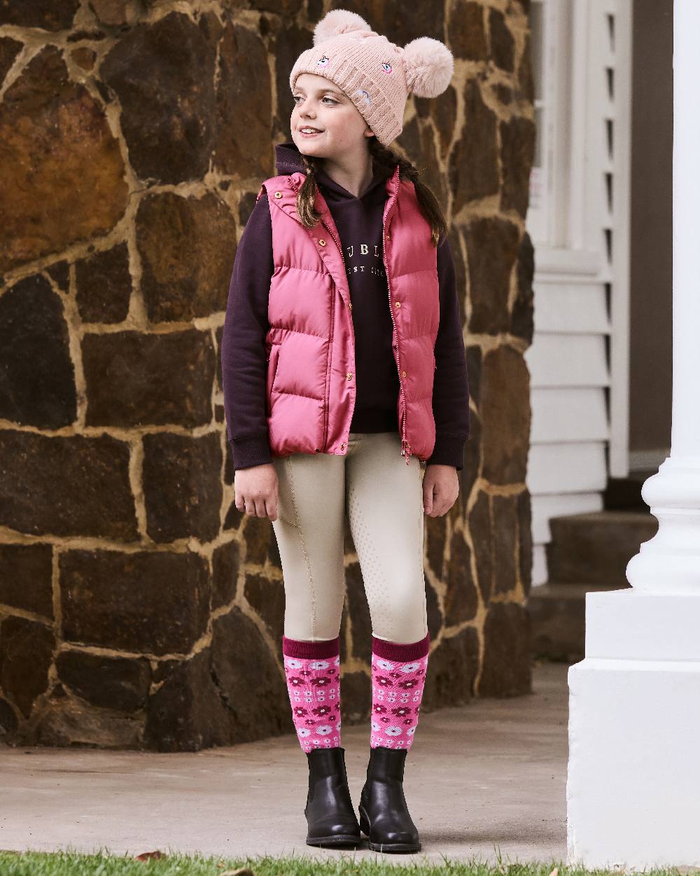 Red Violet coloured Dublin Childrens Patrice Everyday Puffer Vest on wall background
