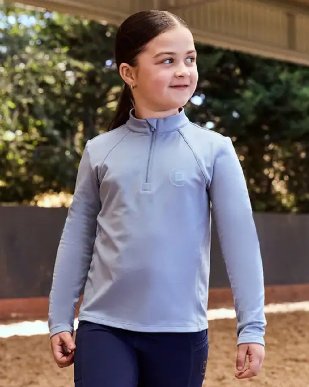 Blue Fog coloured Dublin Kids Brushed Long Sleeve Riding Top on blurry background
