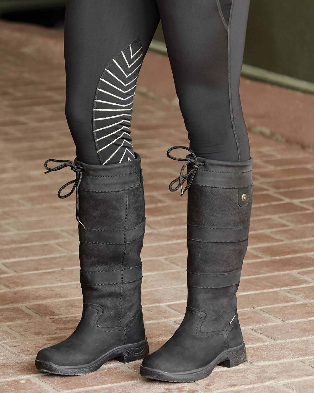 Black coloured Dublin River Boots III on floor background