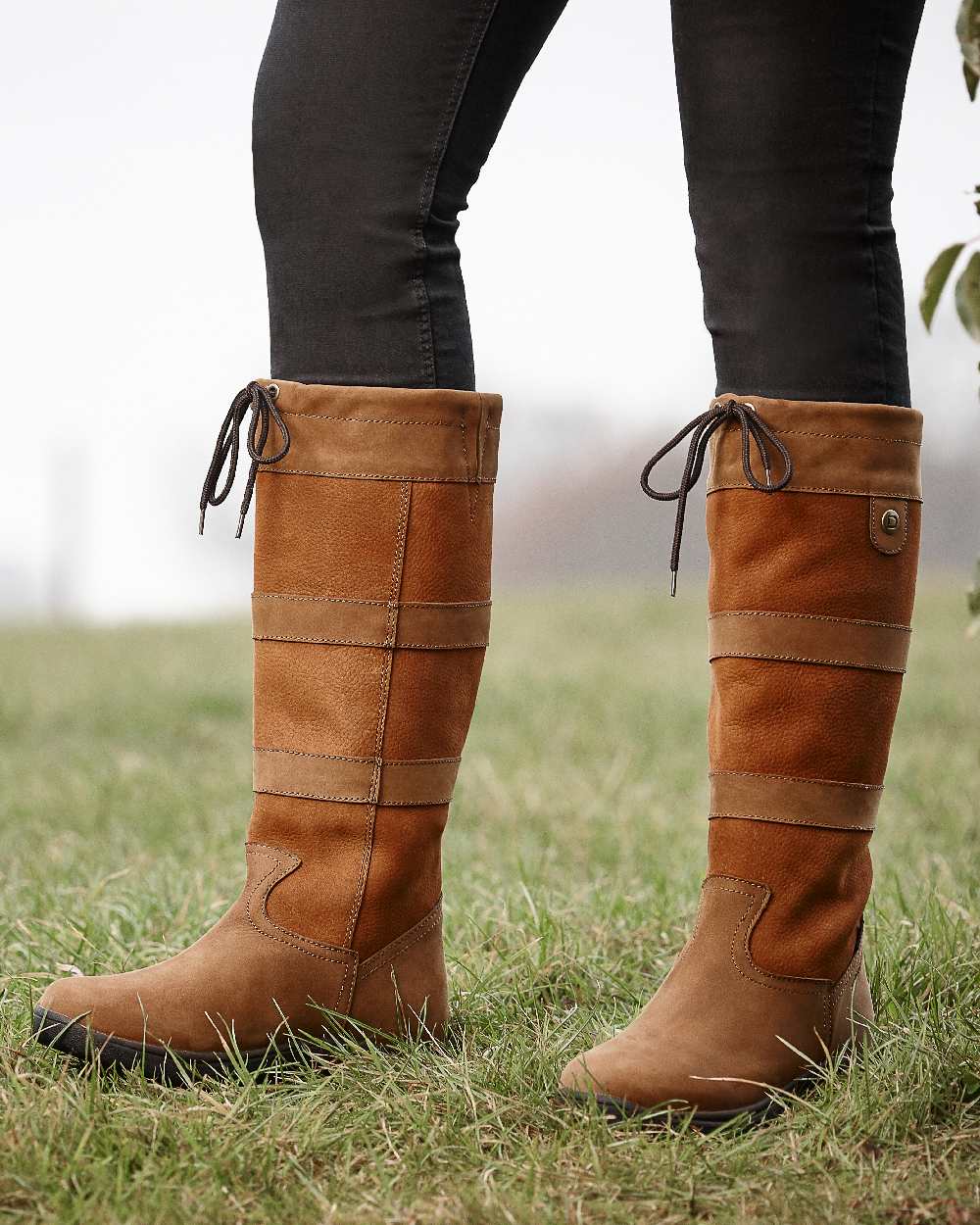Dark Brown coloured Dublin River Boots III on grassy background