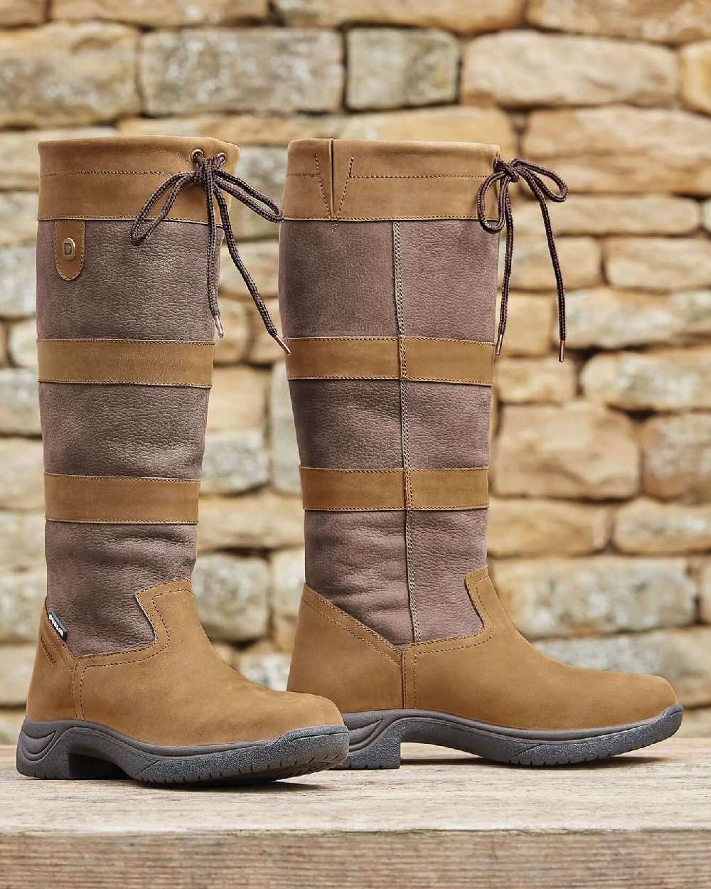 Dark Brown coloured Dublin River Boots III on rock wall background