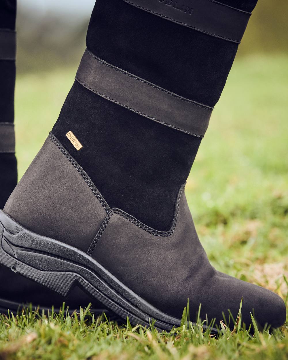 Black Coloured Dublin River Boots IV on grass background