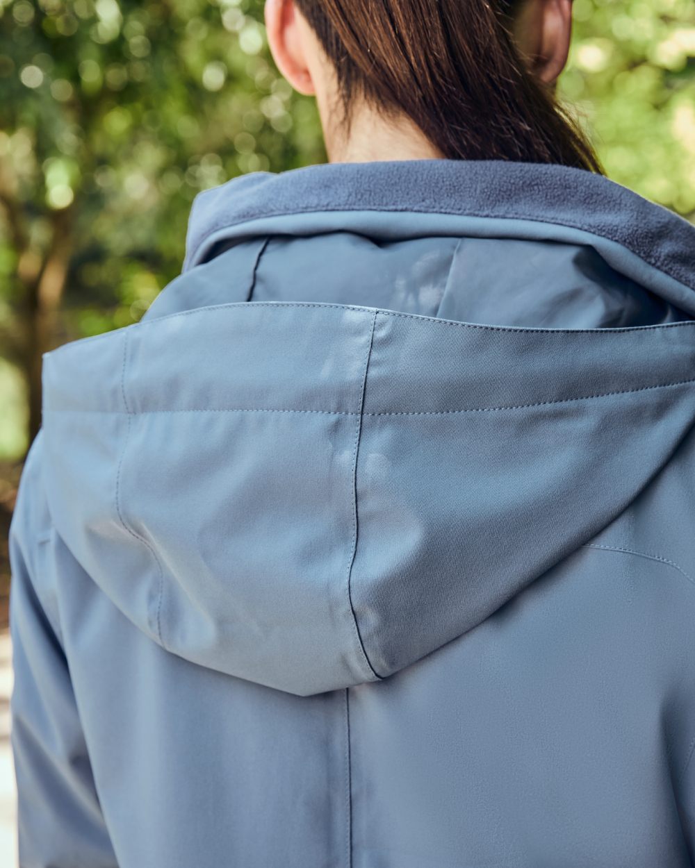 Denim coloured Dublin Womens Everyday Waterproof Jacket on blurry background