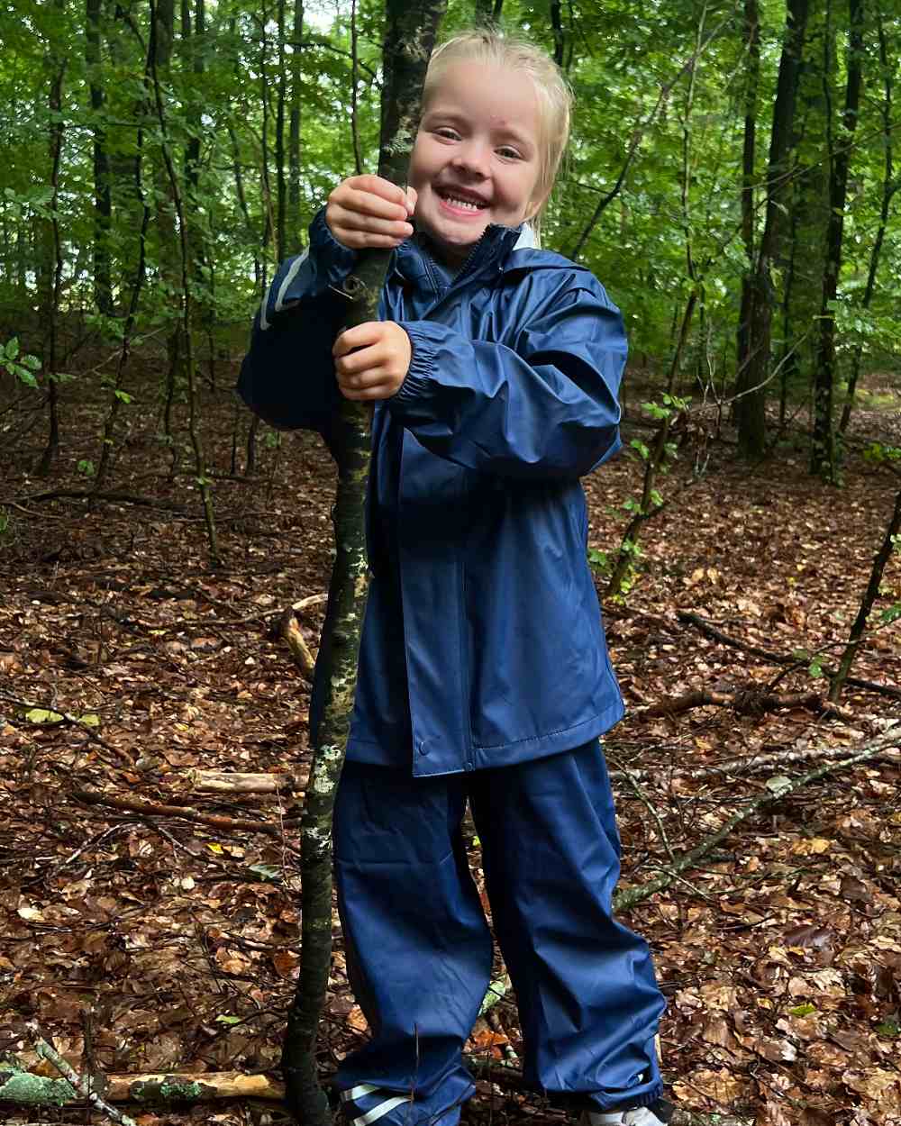 Navy Coloured Elka Childrens Rain Set on forest background