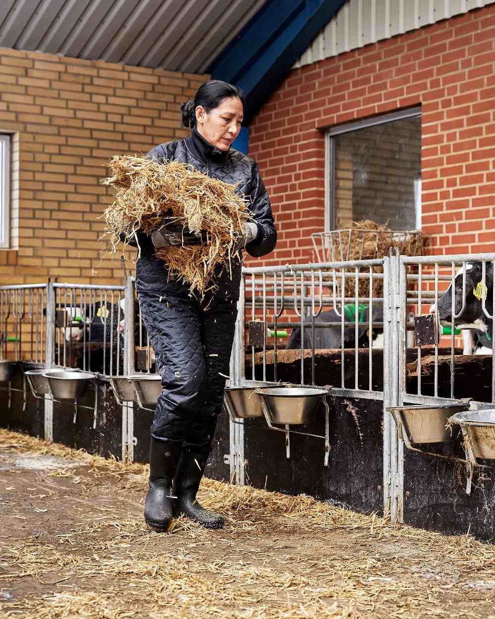 Black Coloured Elka Womens Thermal Trousers on barn background