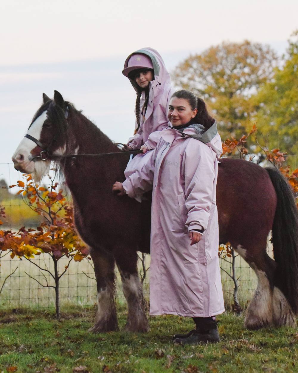 Pink Coloured Equicoat Adults Pro Coat with horse and child 