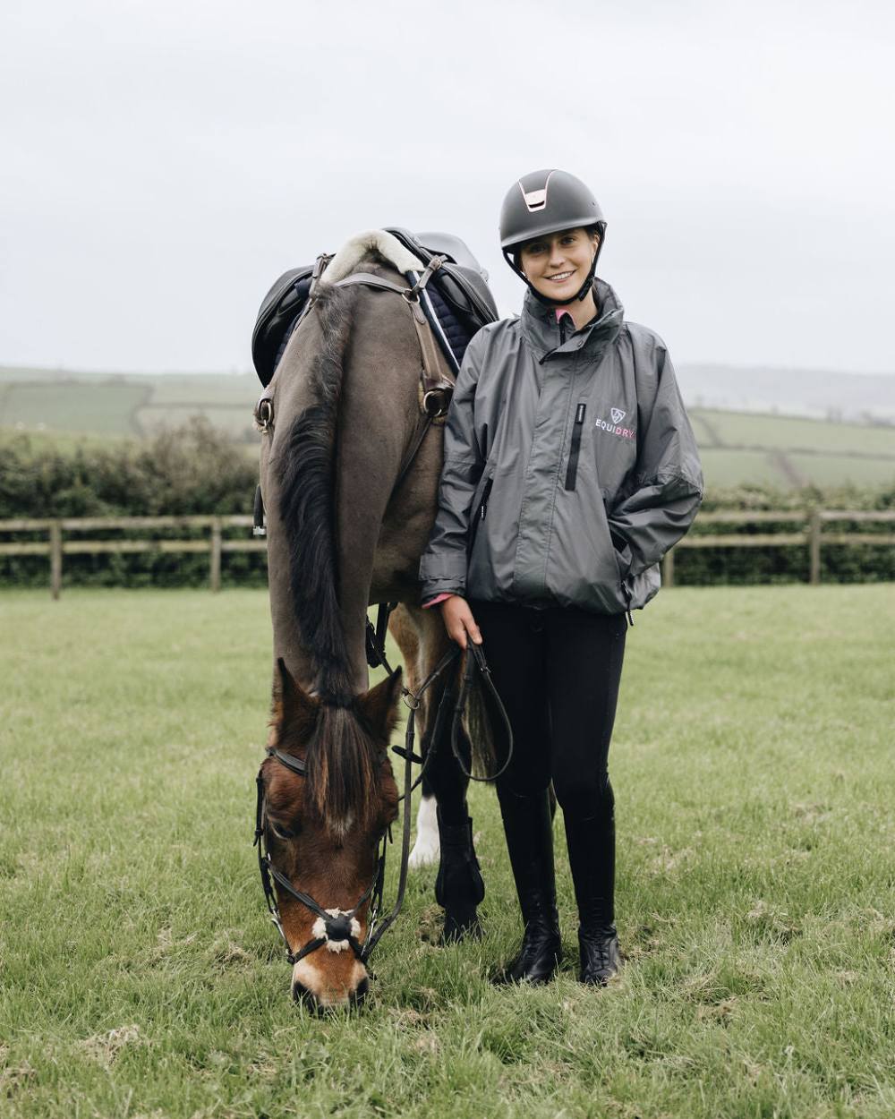 Charcoal Penelope Pink coloured Equidry Childrens Shortie Jacket on lawn background