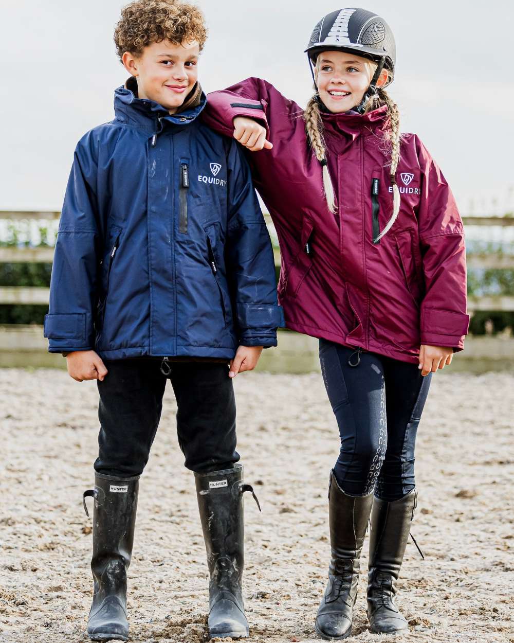 Plum coloured Equidry Childrens Shortie Jacket on street background