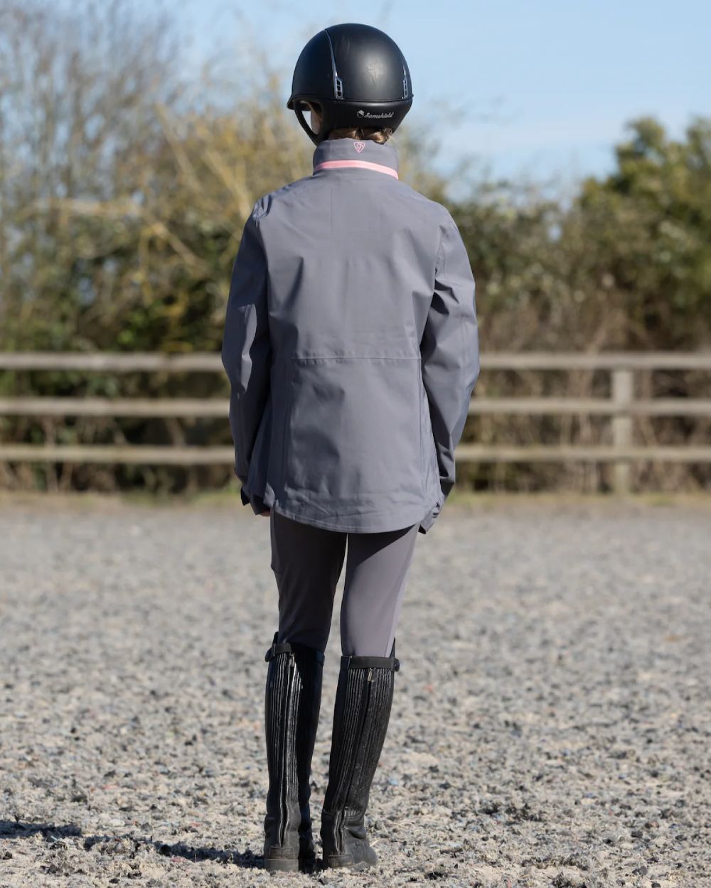 Charcoal Pink Equidry Childrens Varsha Waterproof Jacket on yard background