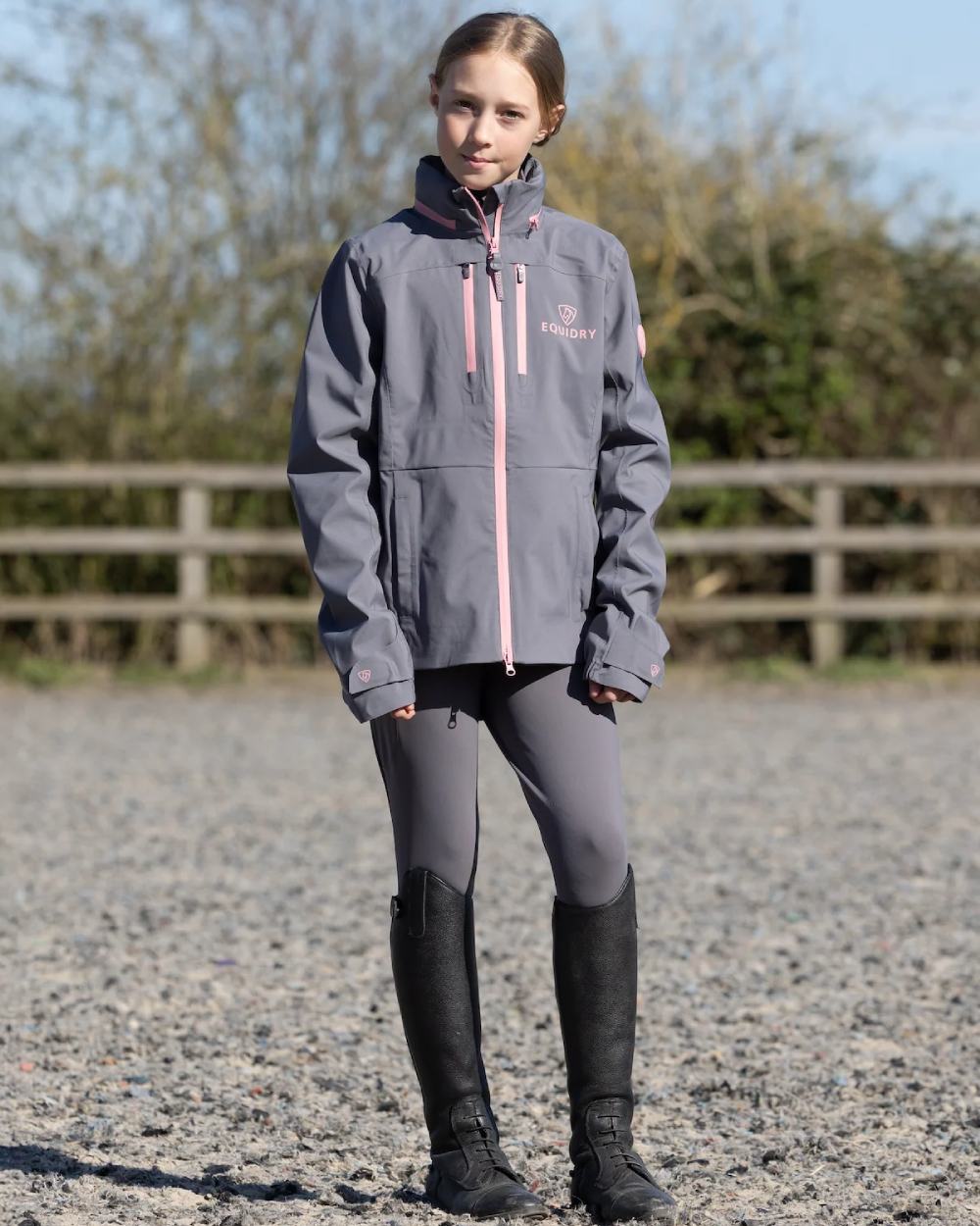 Charcoal Pink Equidry Childrens Varsha Waterproof Jacket on yard background