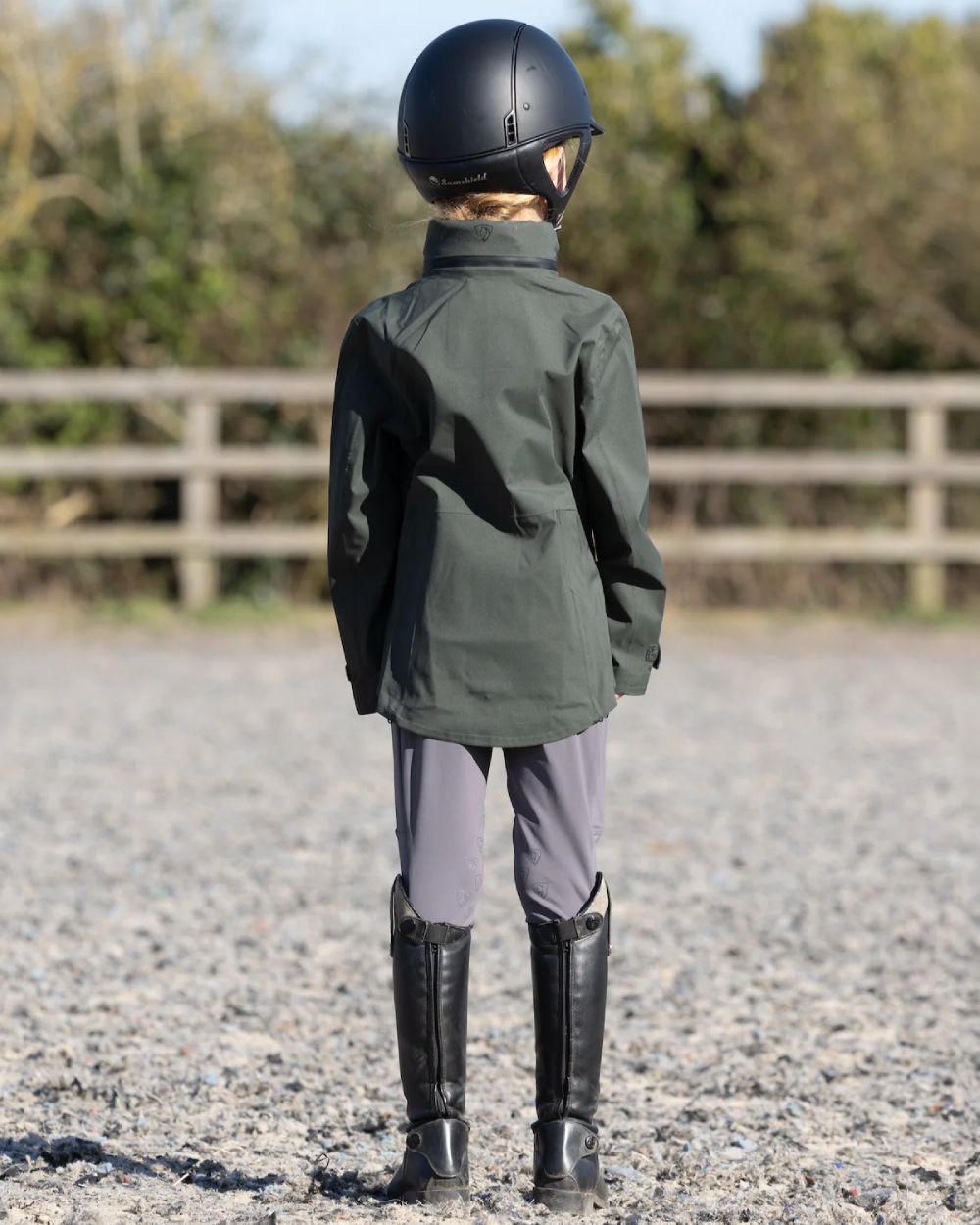 Khaki Equidry Childrens Varsha Waterproof Jacket on yard background
