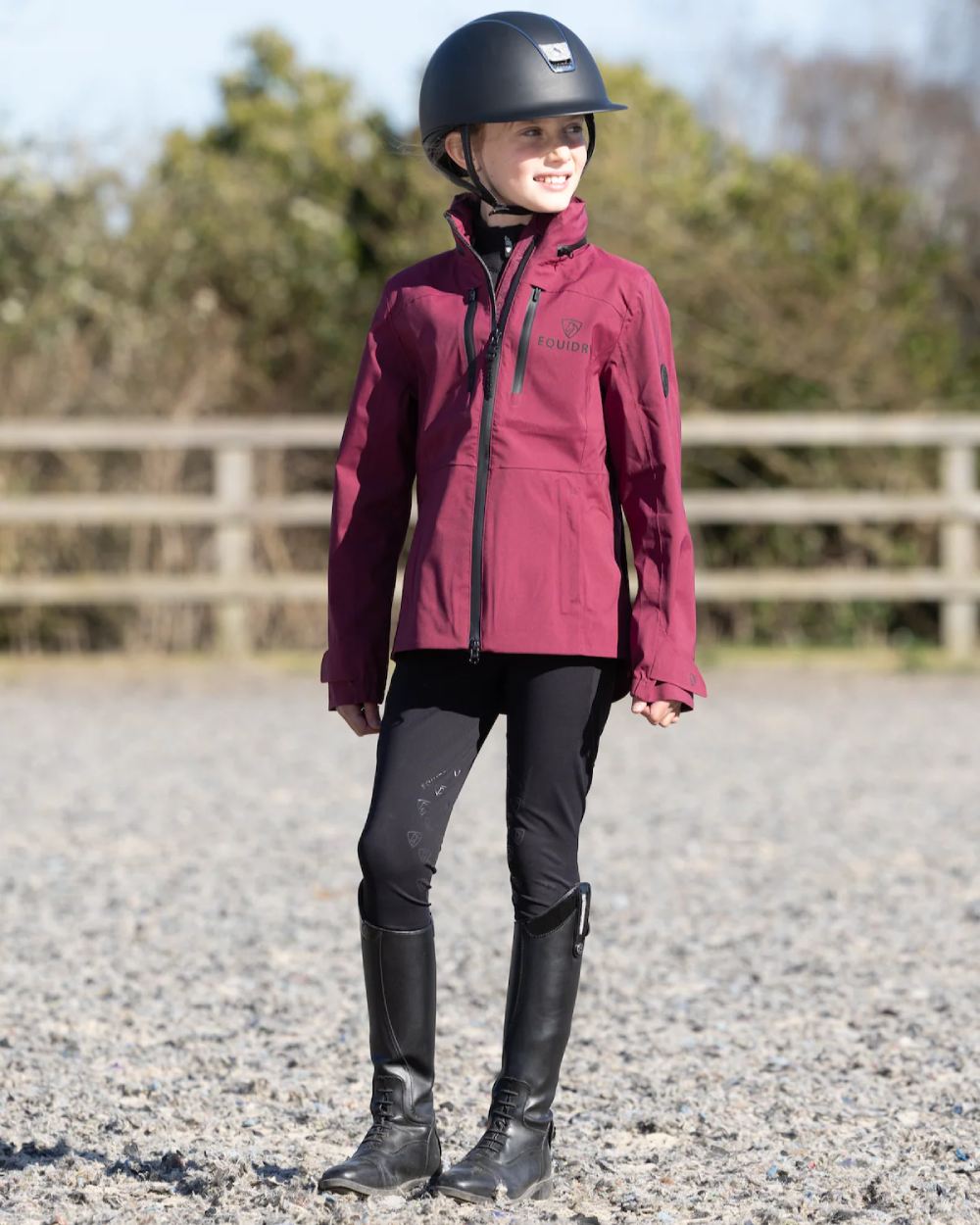 Plum Equidry Childrens Varsha Waterproof Jacket on outdoor background