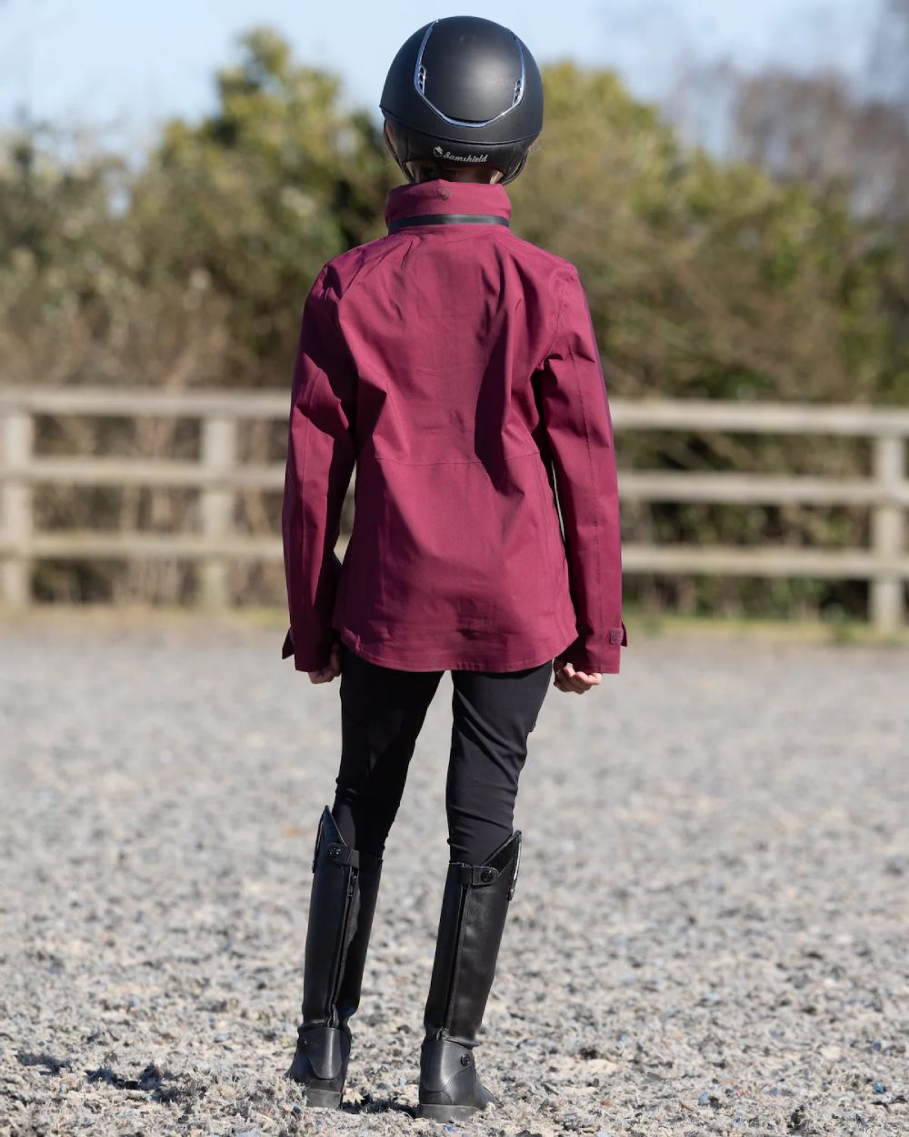 Plum Equidry Childrens Varsha Waterproof Jacket on outdoor background