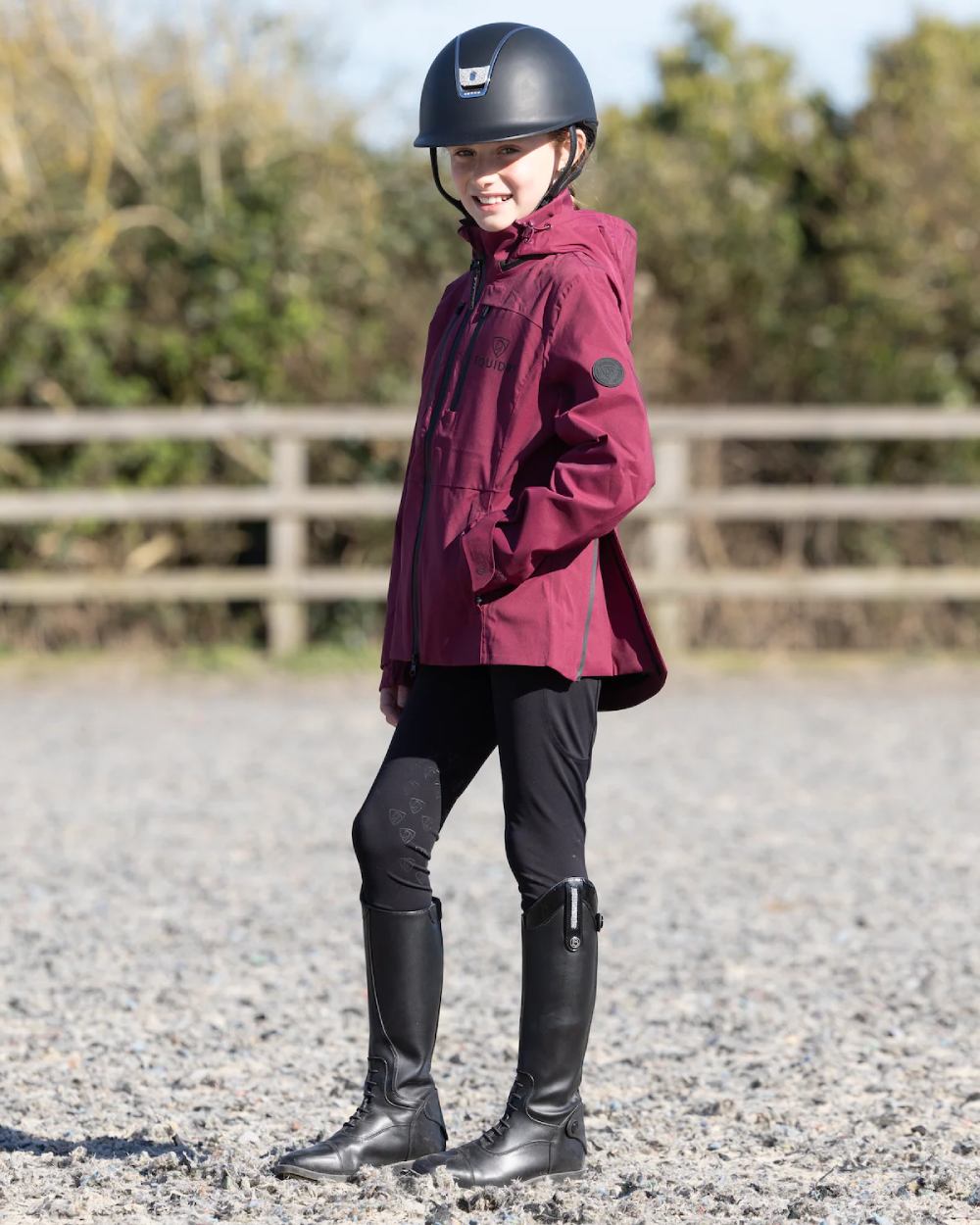 Plum Equidry Childrens Varsha Waterproof Jacket on outdoor background
