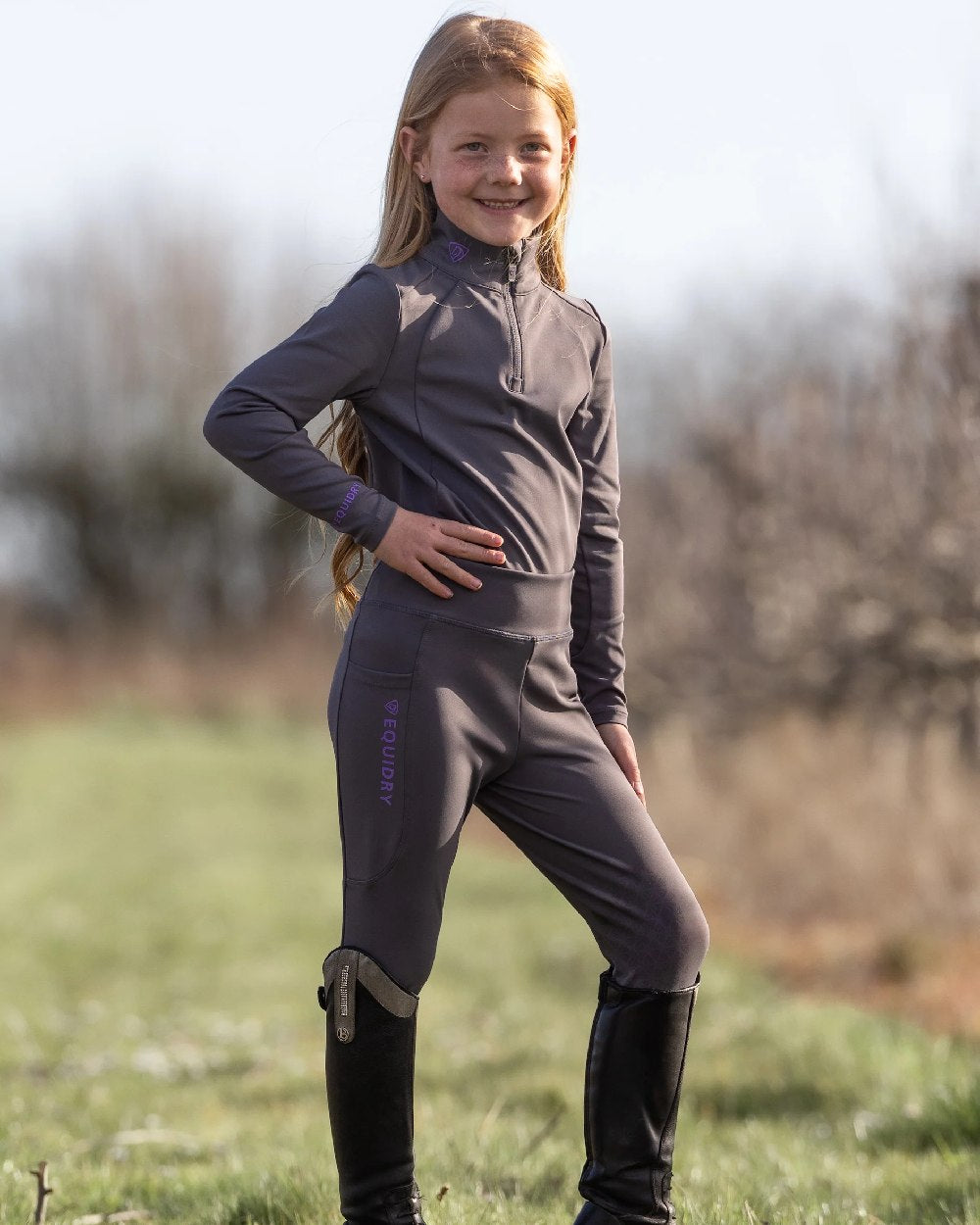 Grey Lilac Coloured Equidry Childrens Water Repellent Base Layer on outdoor background