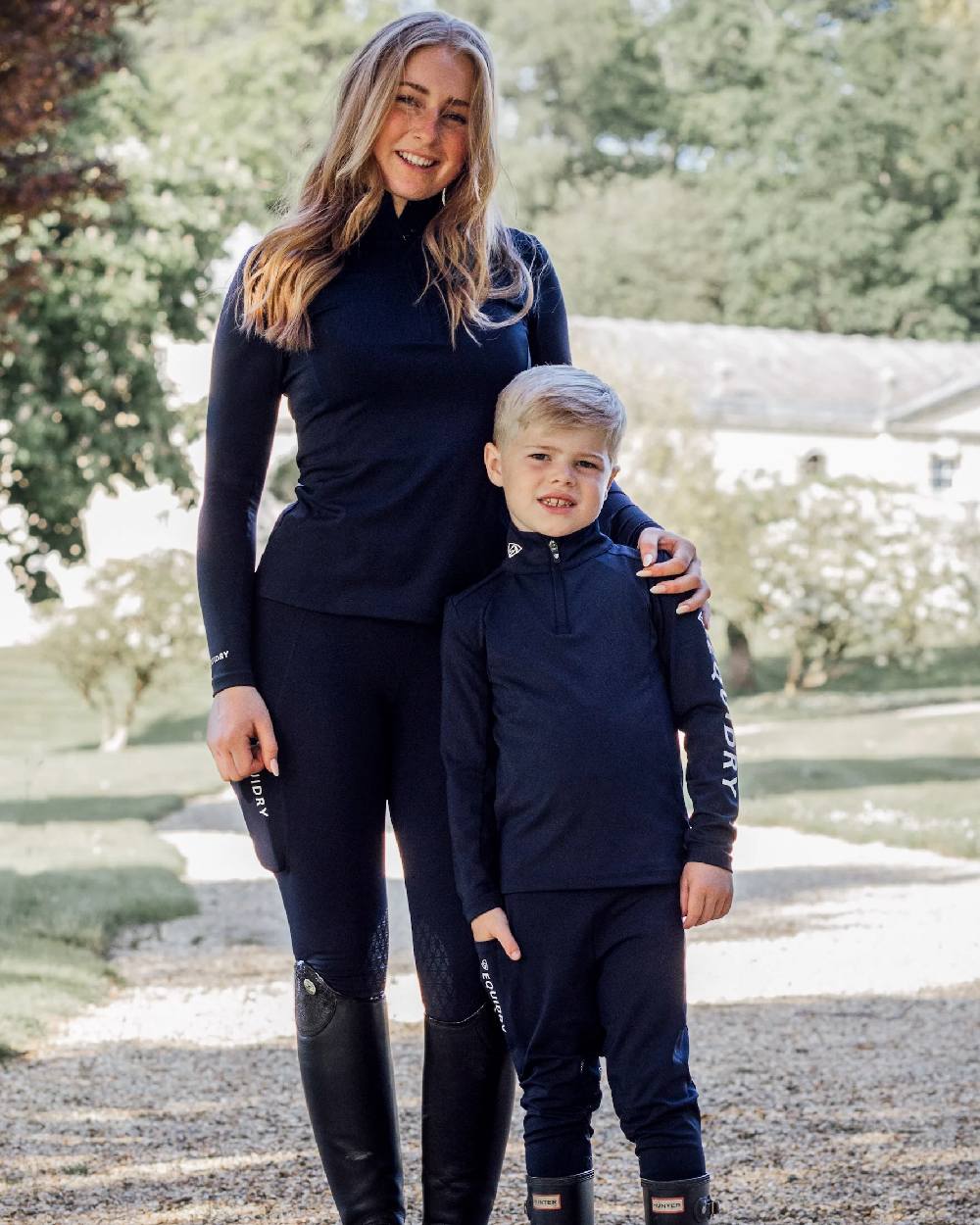 Navy White Coloured Equidry Childrens Water Repellent Base Layer on outdoor background