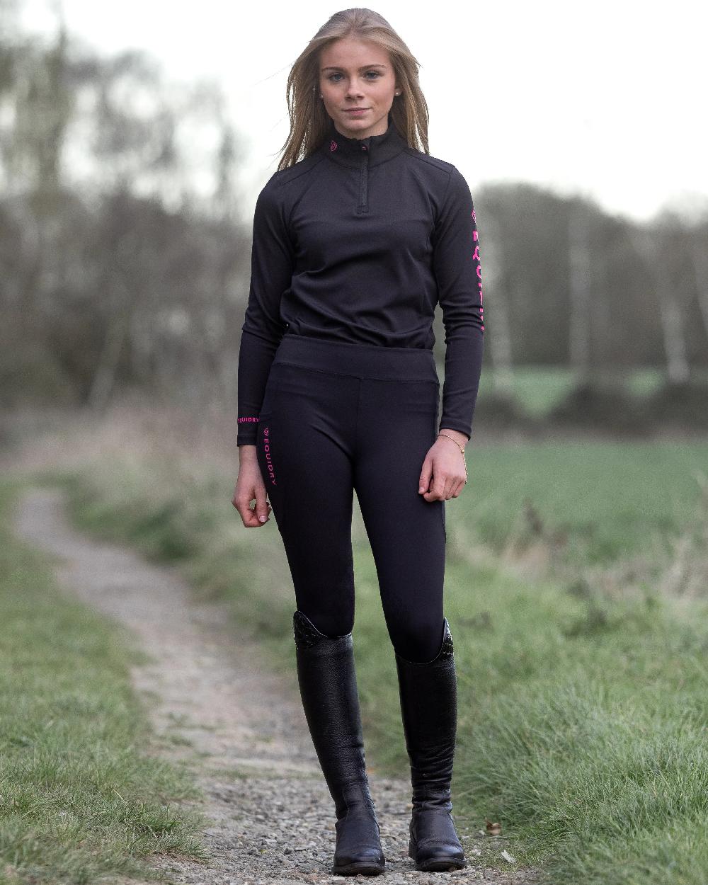Black Pink Coloured Equidry Childrens Water Repellent Full Seat Leggings on outdoor background