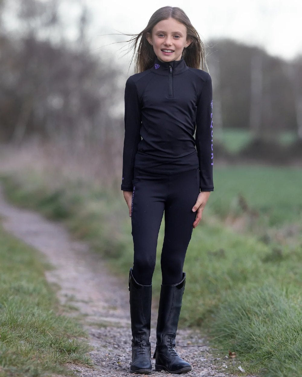 Black Lilac Coloured Equidry Childrens Water Repellent Knee Grip Leggings on outdoor background
