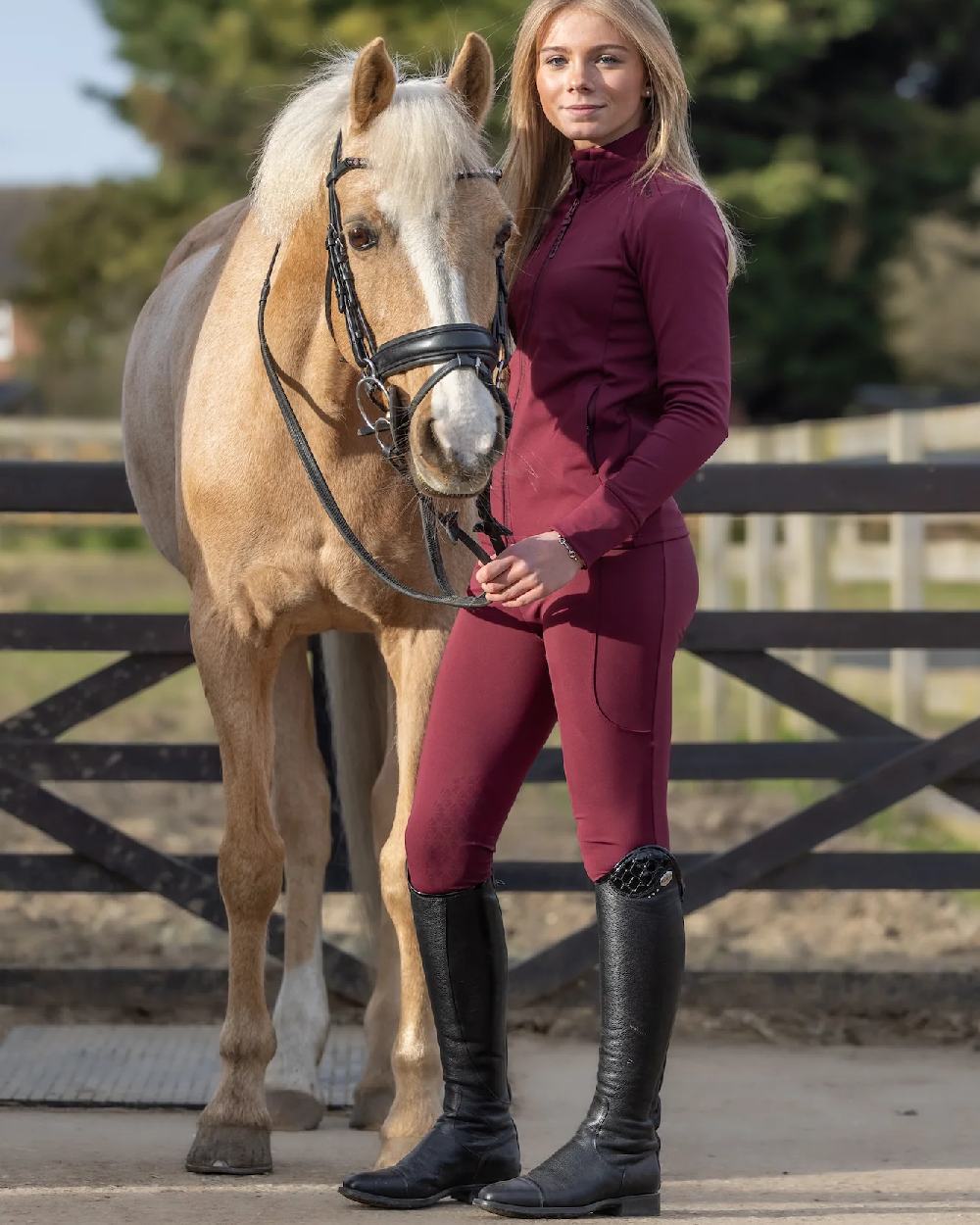 Plum Black Coloured Equidry Childrens Water Repellent Knee Grip Leggings on outdoor background