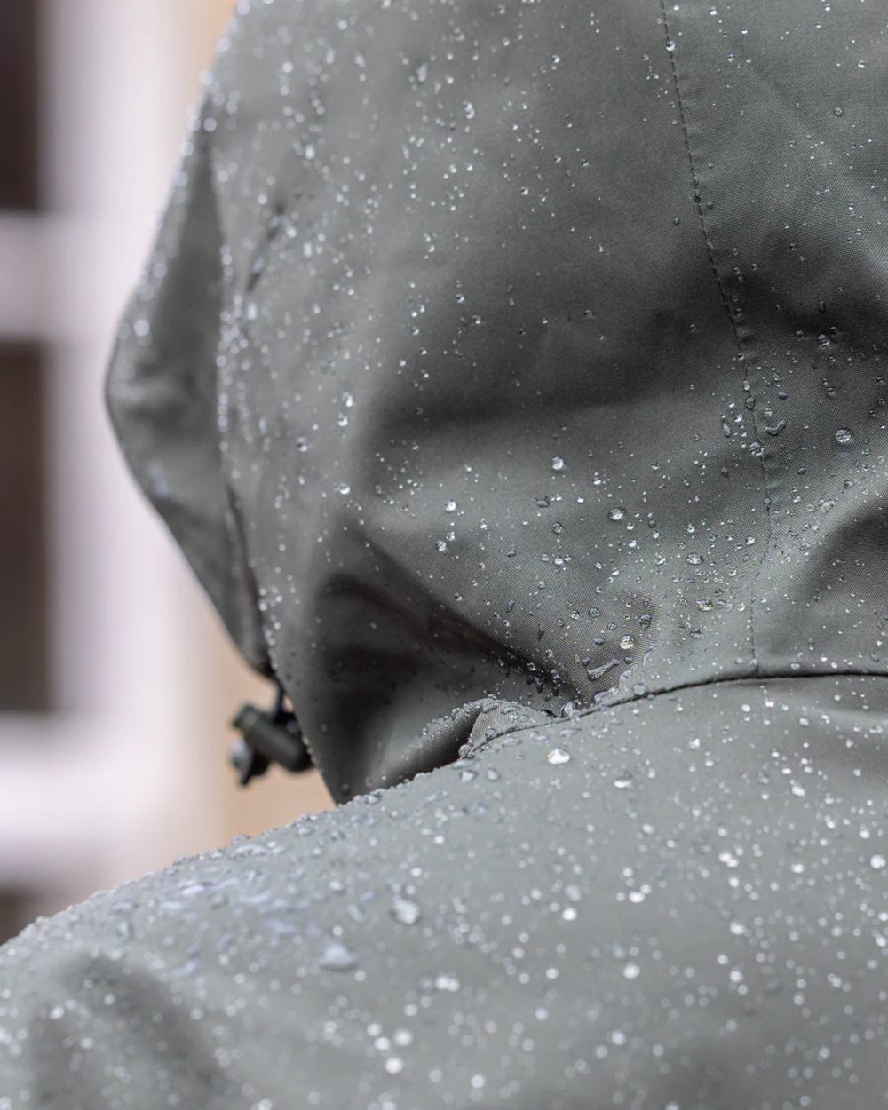 Black Forest Green coloured Equidry Mens Storm Smock With Velour Lining on outdoor background