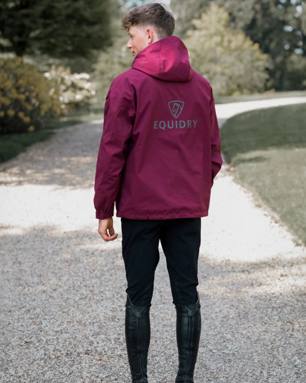 Plum coloured Equidry Mens Storm Smock With Velour Lining on outdoor background