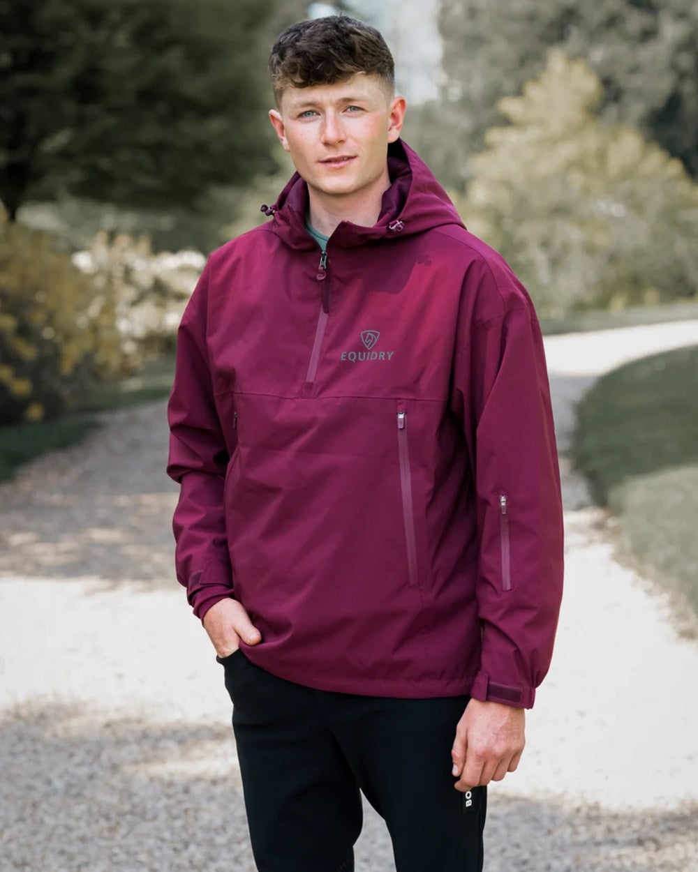 Plum coloured Equidry Mens Storm Smock With Velour Lining on outdoor background