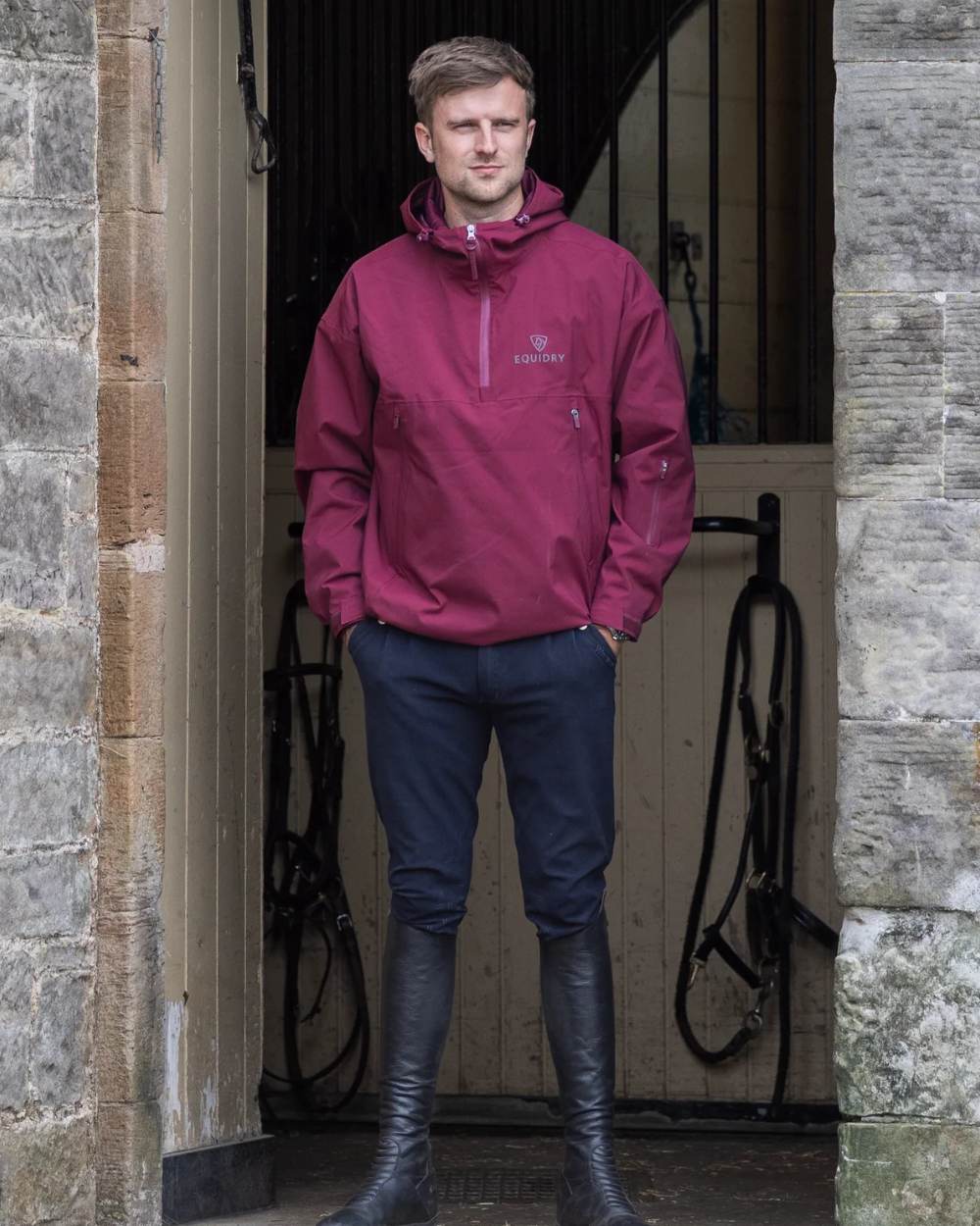 Plum coloured Equidry Mens Storm Smock With Velour Lining on outdoor background