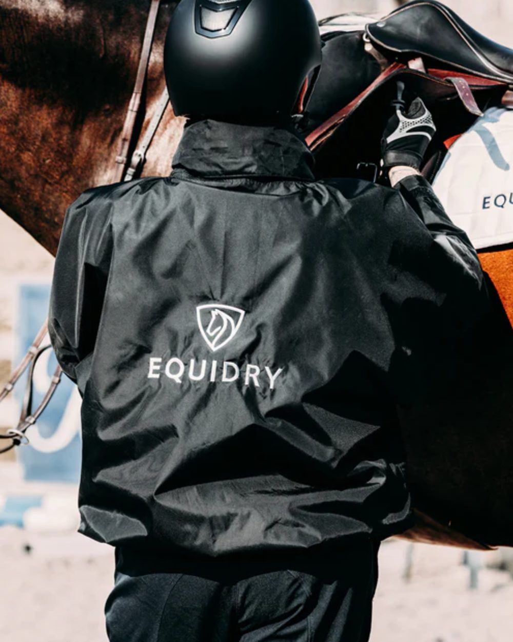 Black coloured Equidry Mens Thin Fleece Shortie Jacket With Stowaway Hood on outdoor background