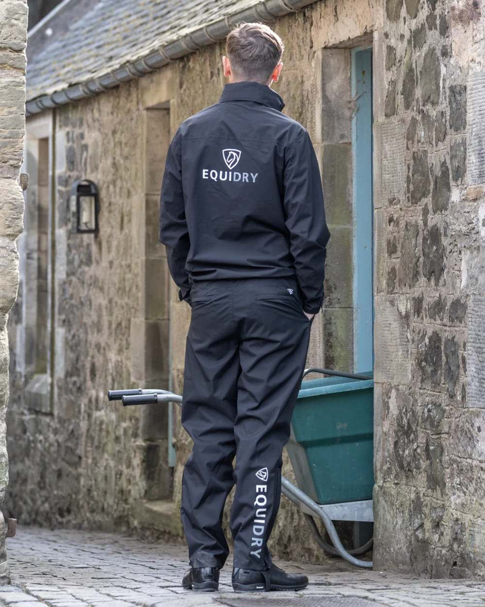 Black coloured Equidry Mens Unlined Waterproof Trousers on outdoor background