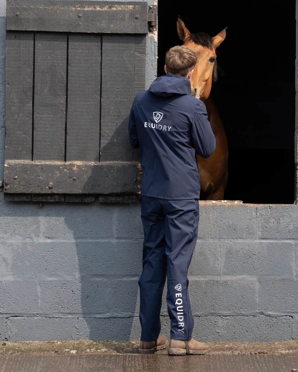 Navy coloured Equidry Mens Unlined Waterproof Trousers on outdoor background