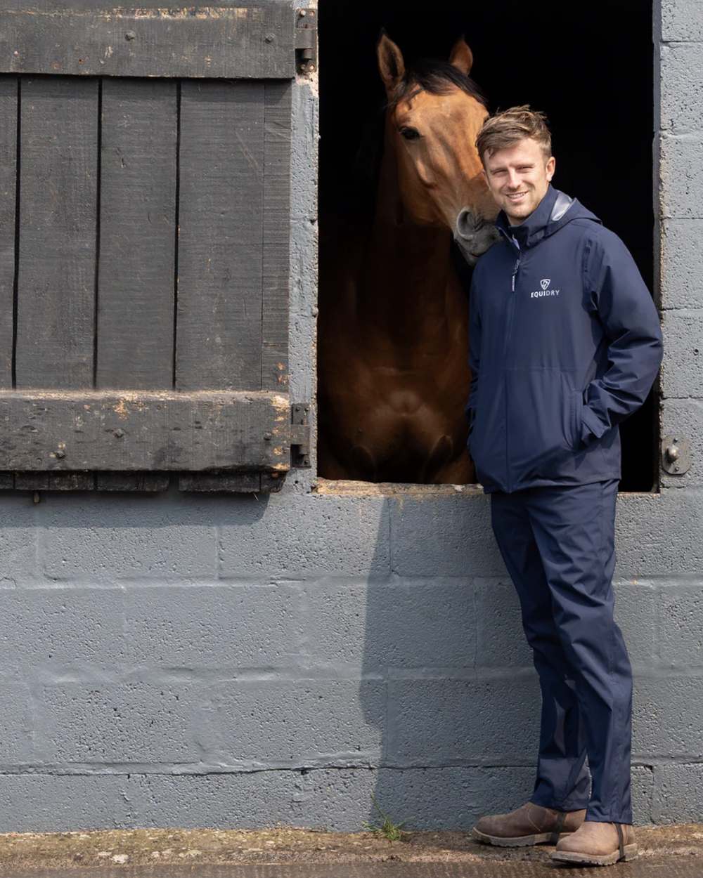 Navy coloured Equidry Mens Unlined Waterproof Trousers on outdoor background