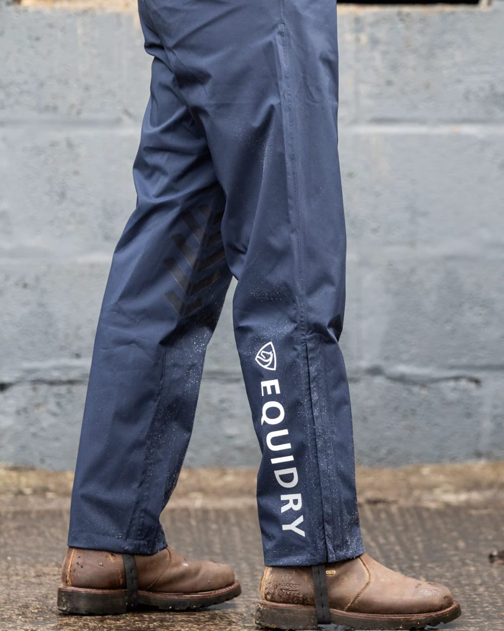 Navy coloured Equidry Mens Unlined Waterproof Trousers on outdoor background