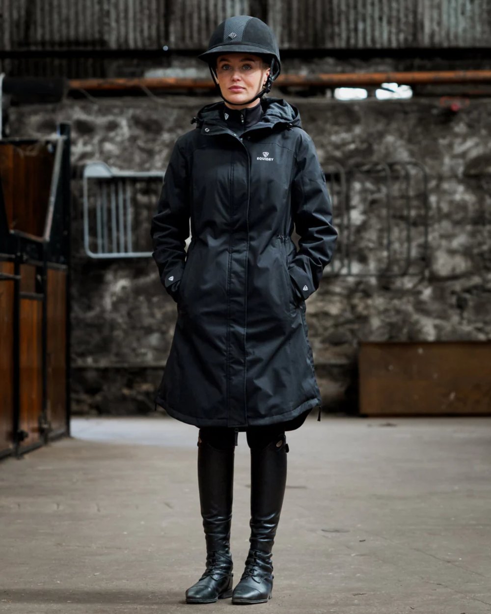 Black coloured Equidry Womens Bronte Riding Coat on outdoor background