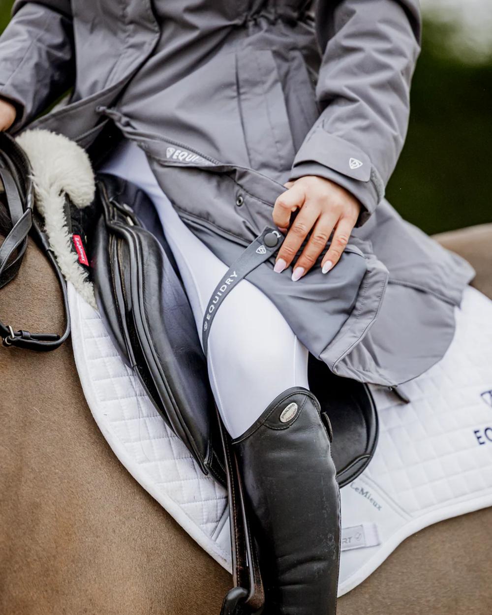 Charcoal coloured Equidry Womens Bronte Riding Coat on outdoor background