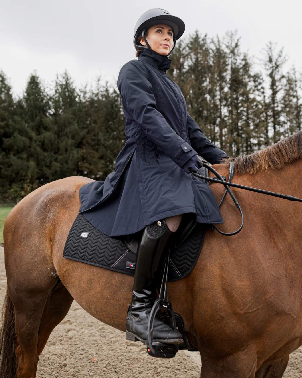 Navy Coloured Equidry Womens Bronte Riding Coat With Removable Hood on outdoor background