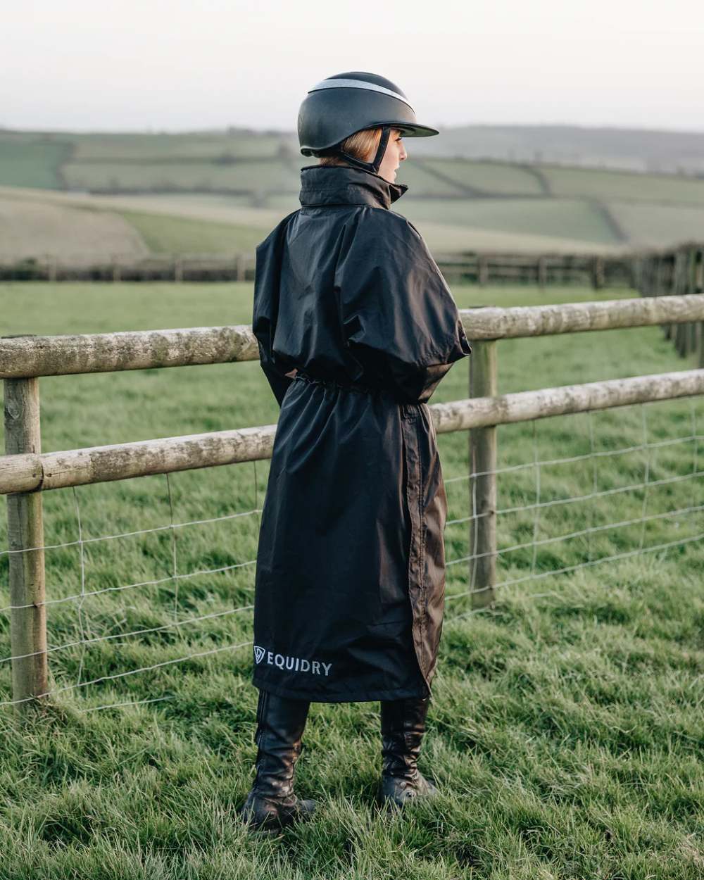 Black coloured Equidry Womens Equimac Evolution Jacket on farm background