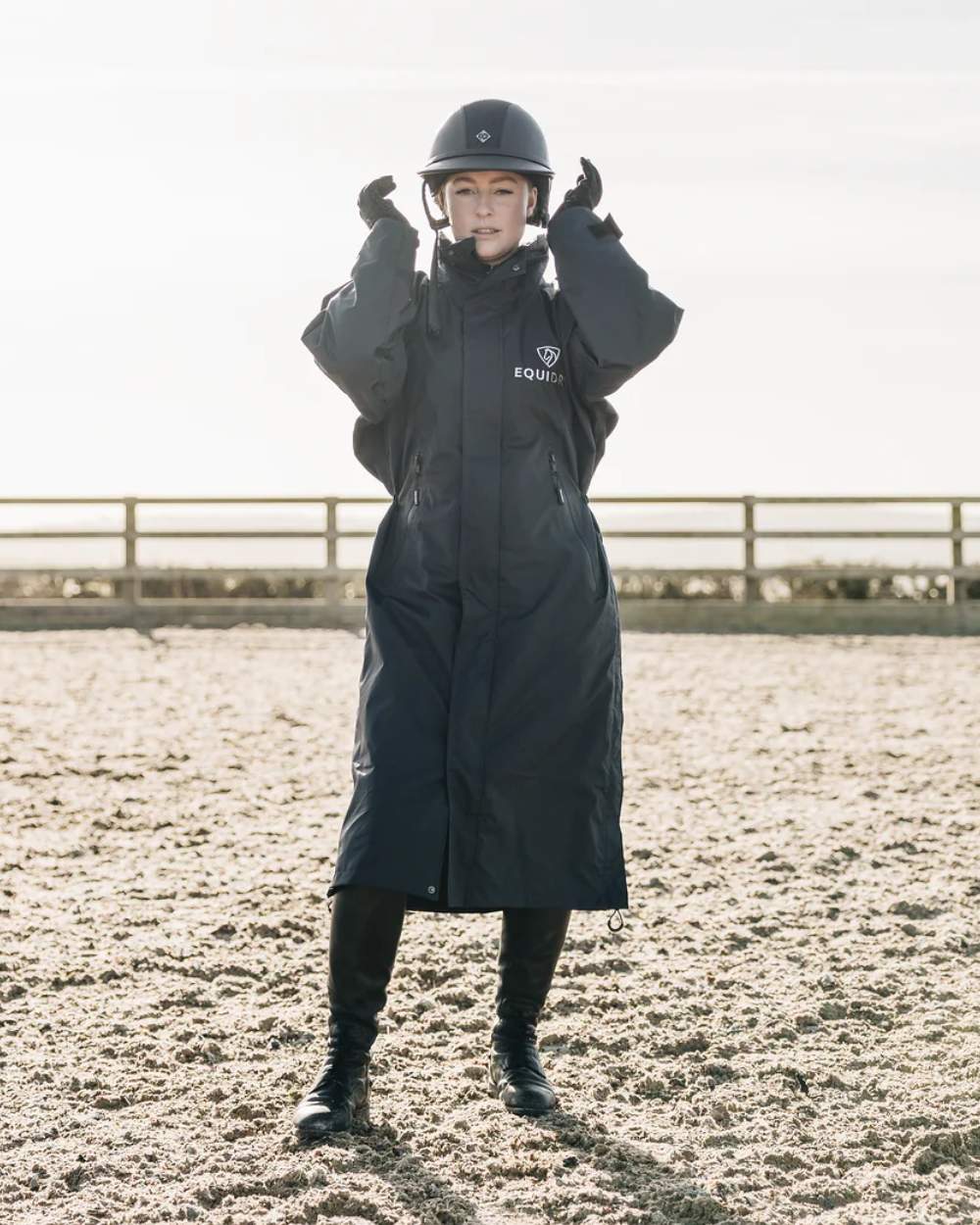Black coloured Equidry Womens Equimac Evolution Jacket on farm background