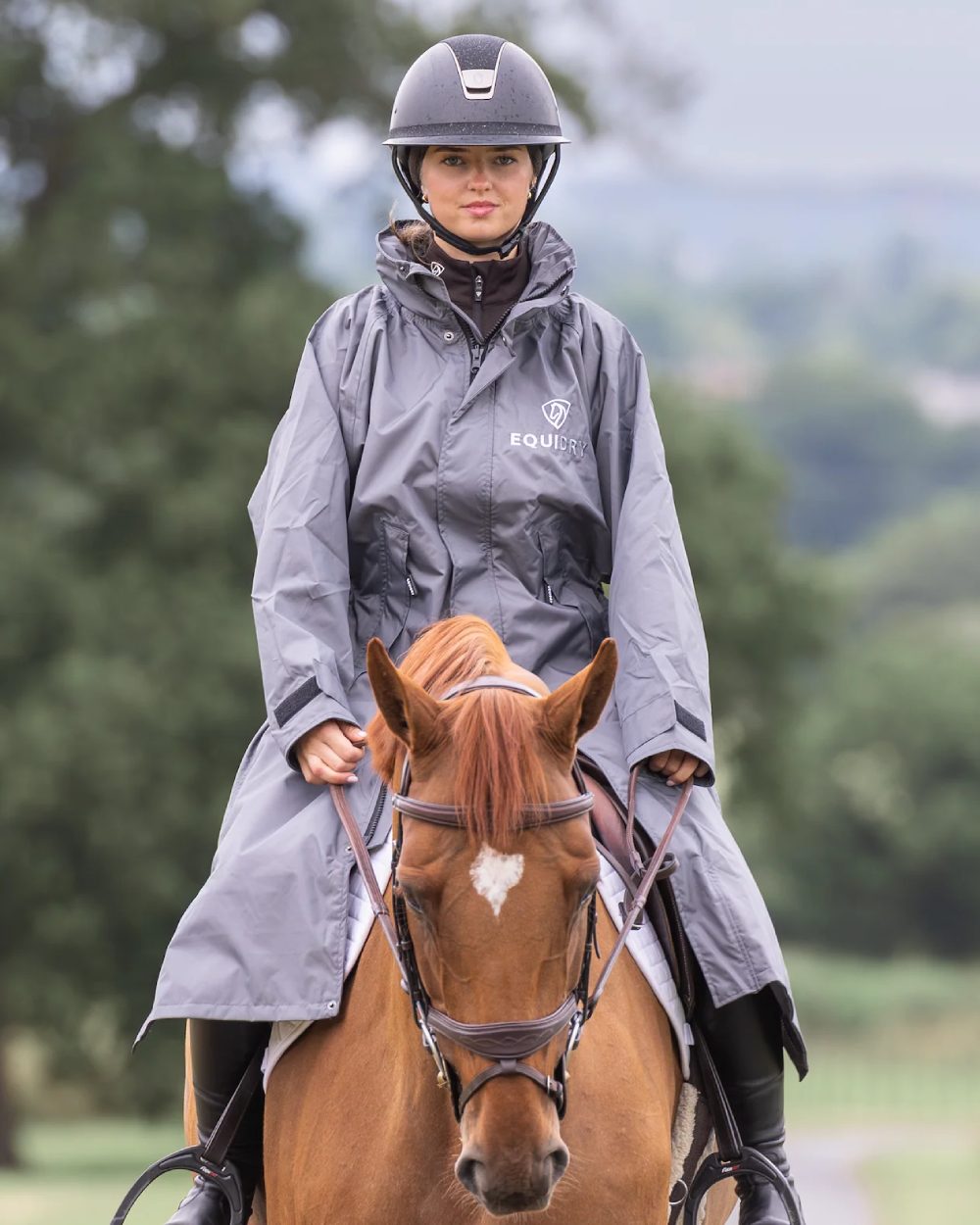 Charcoal Grey coloured Equidry Womens Equimac Evolution Jacket on blurry background