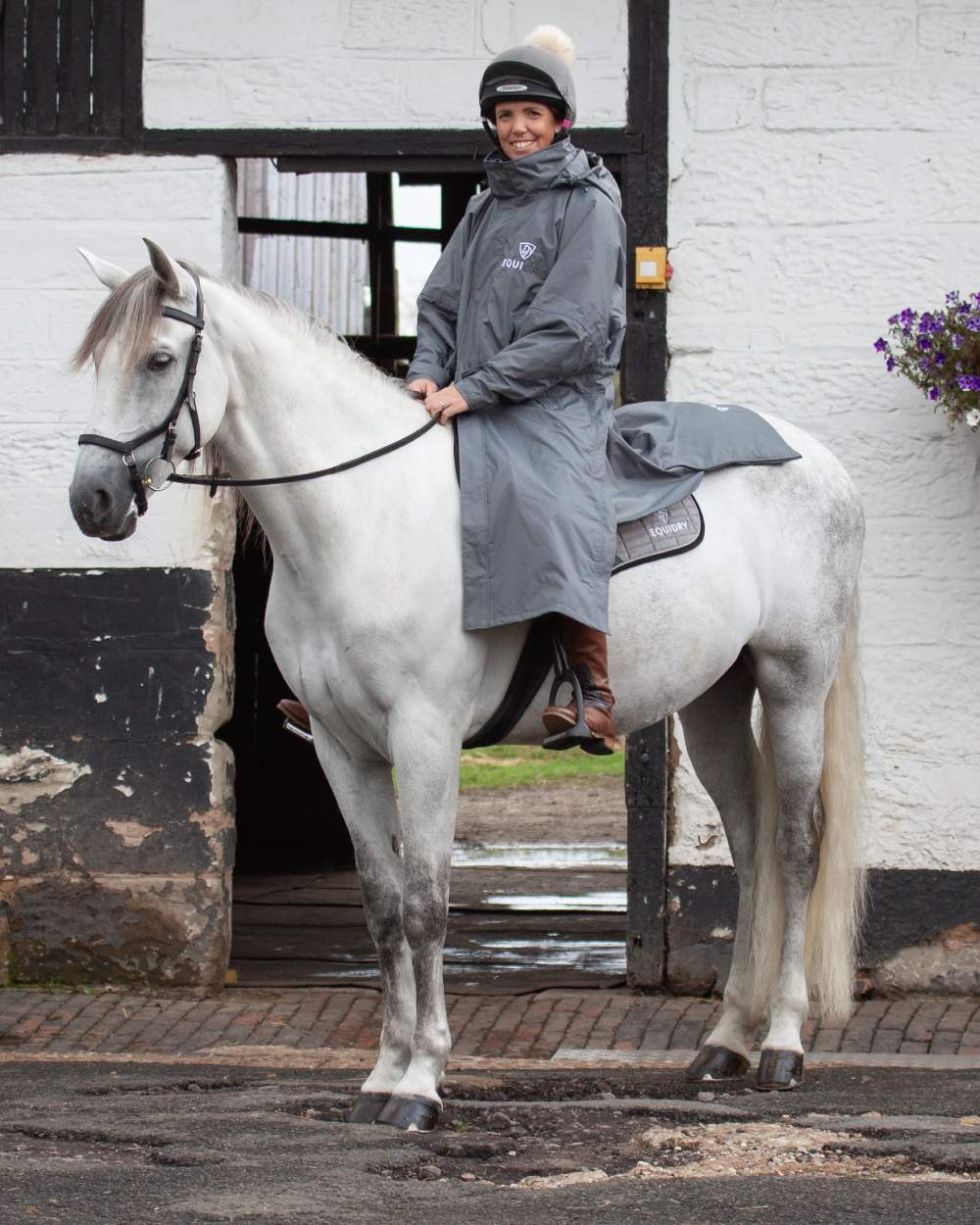 Charcoal Grey coloured Equidry Womens Equimac Evolution Jacket on street background