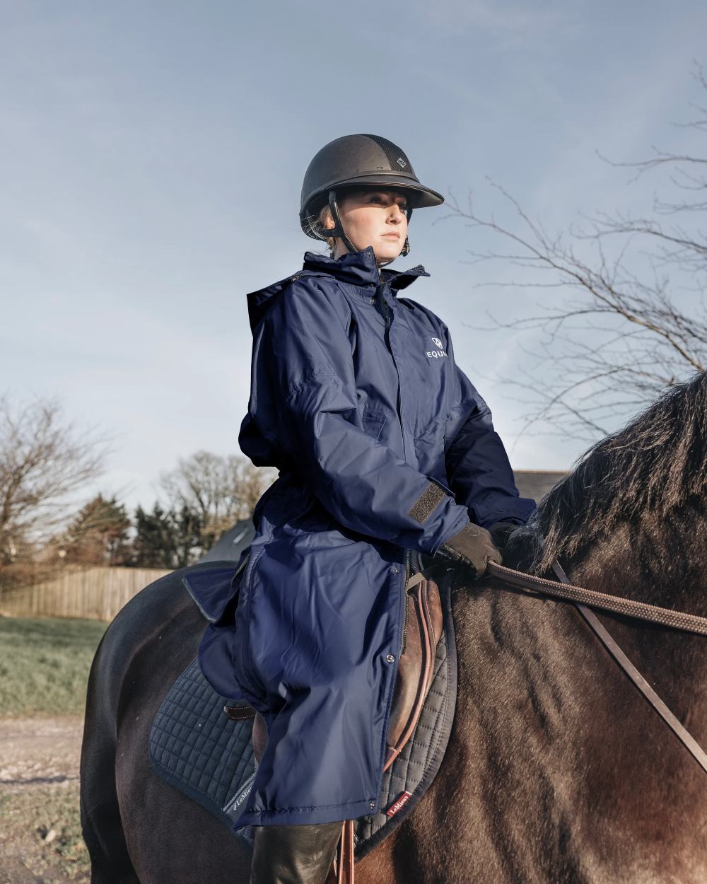 Dark Navy coloured Equidry Womens Equimac Evolution Jacket on farm background
