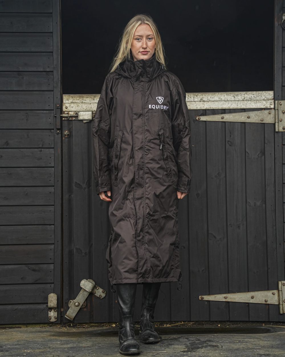 Rich Brown coloured Equidry Womens Equimac Evolution Jacket on stable background