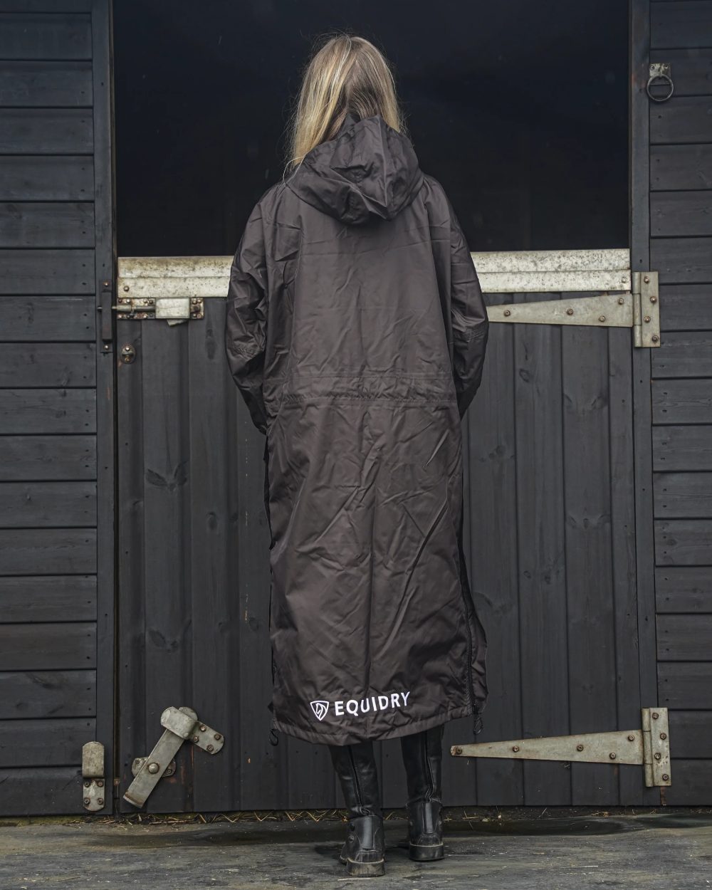 Rich Brown coloured Equidry Womens Equimac Evolution Jacket on stable background