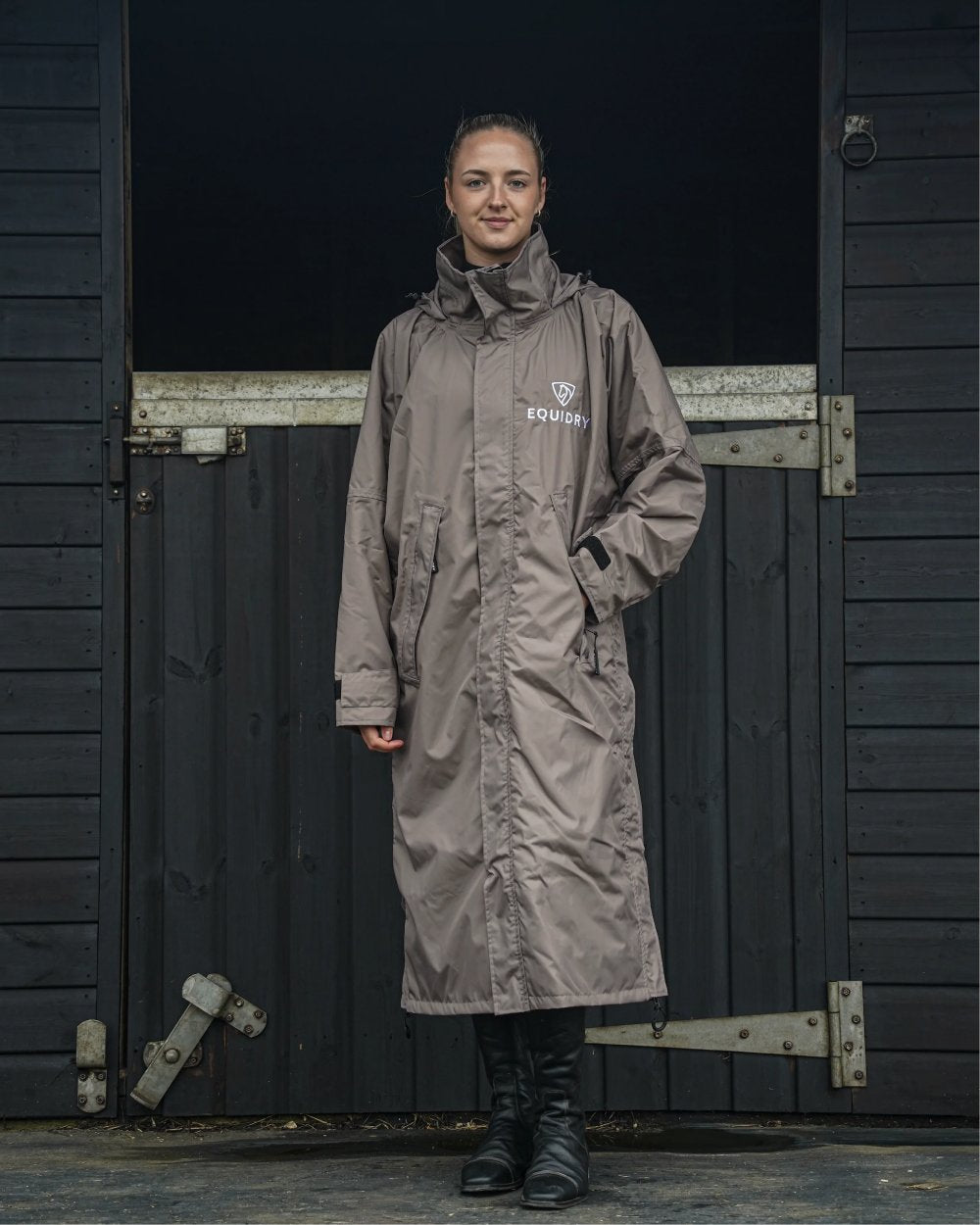 Taupe coloured Equidry Womens Equimac Evolution Jacket on stable background