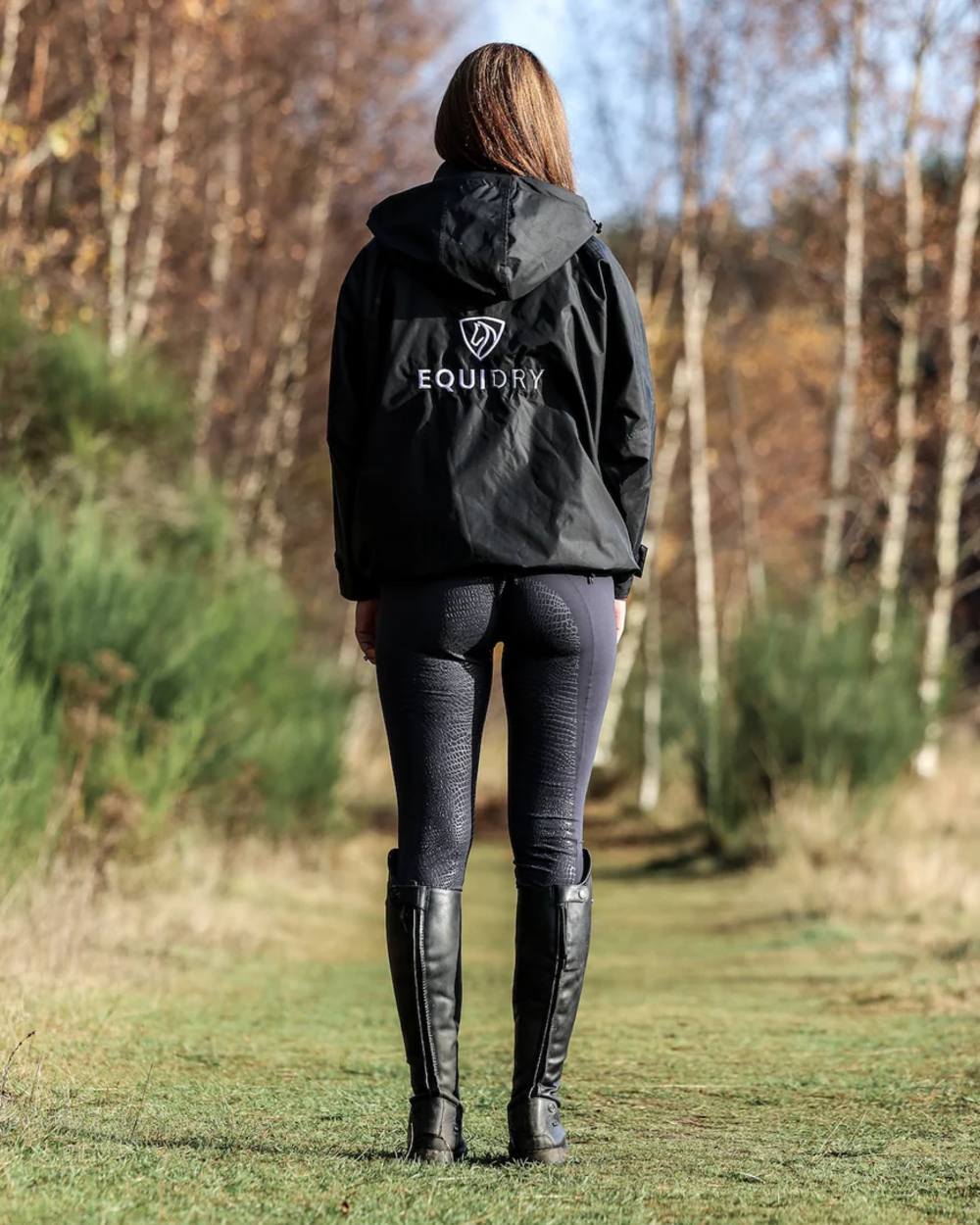 Black coloured Equidry Womens Equimac Shortie With Stowaway Hood on outdoor background
