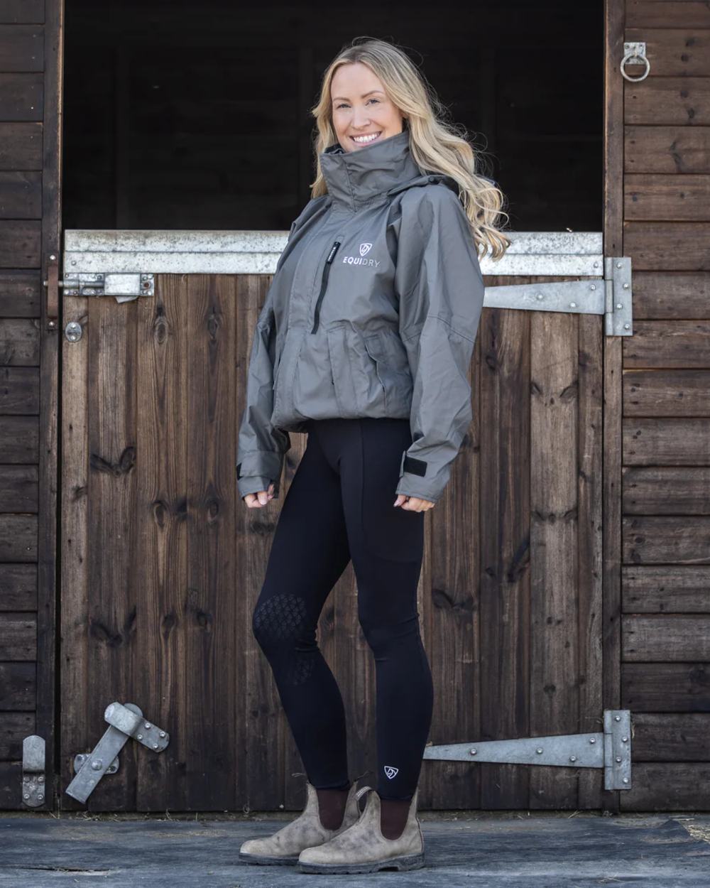 Charcoal coloured Equidry Womens Equimac Shortie With Stowaway Hood on outdoor background