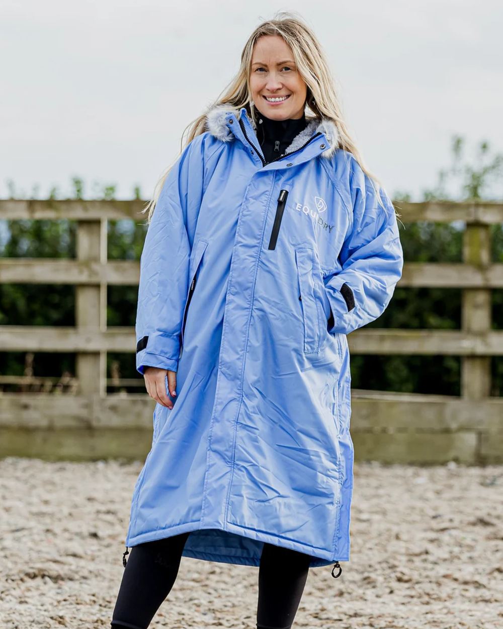 Sky Blue Grey coloured Equidry Womens Evolution Thick Fleece With Fur Hood on sand background