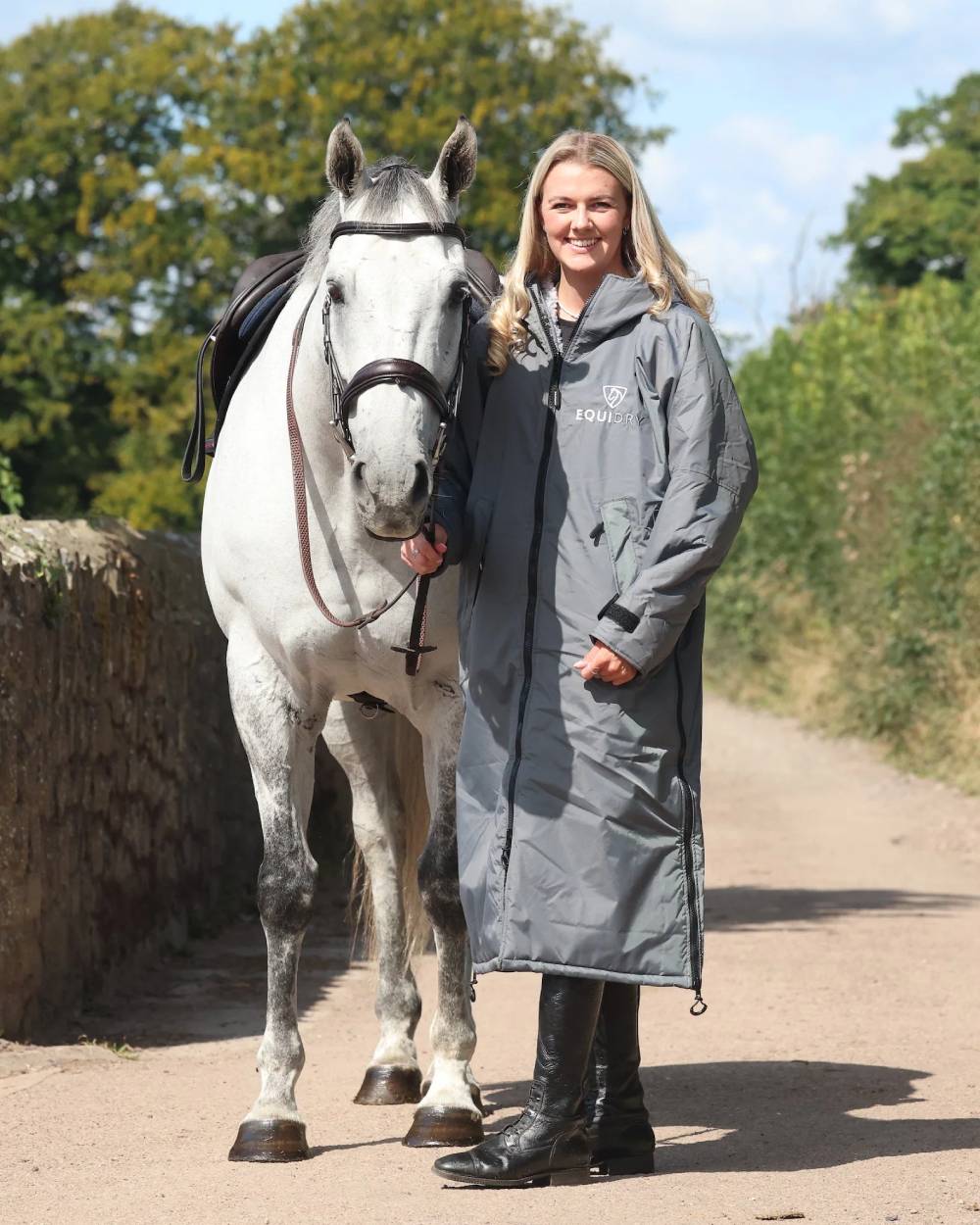 Charcoal Grey coloured Equidry Womens Original All Rounder Waterproof Coat on outdoor background
